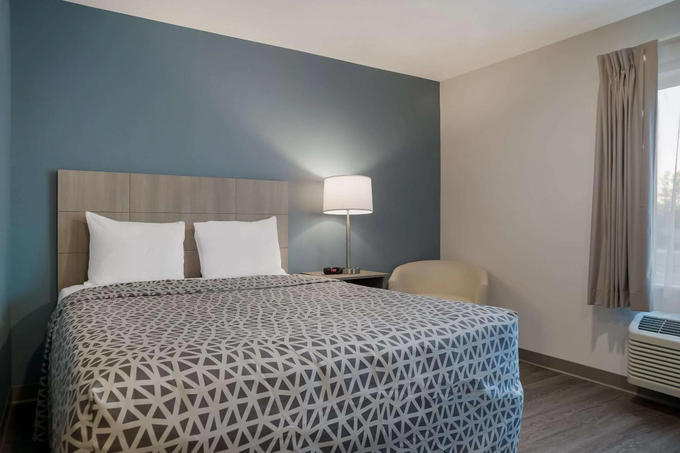 Bedroom, Bed in WoodSpring Suites Detroit Sterling Heights