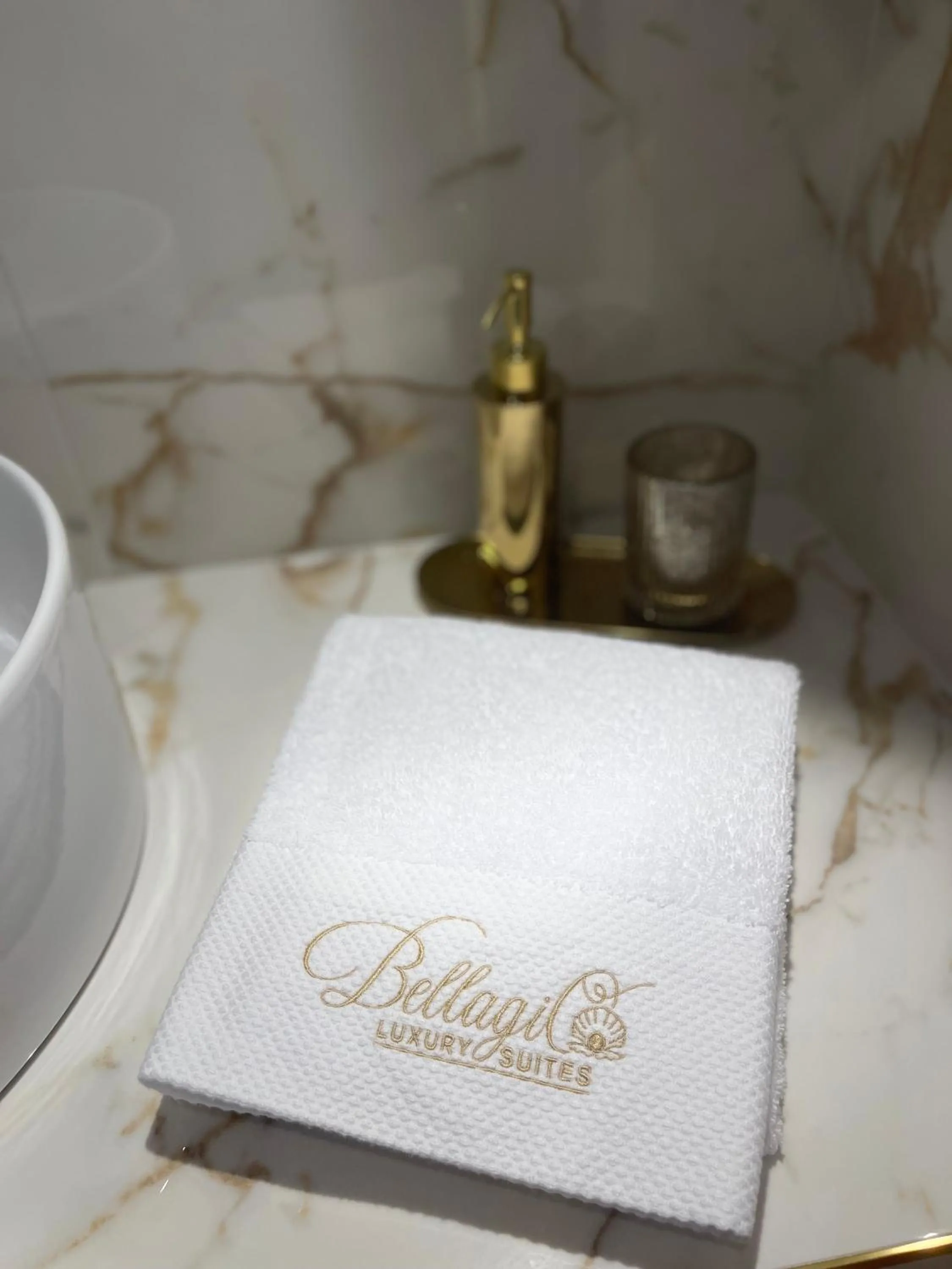 Property logo or sign in Bellagio Luxury Suites Apartments