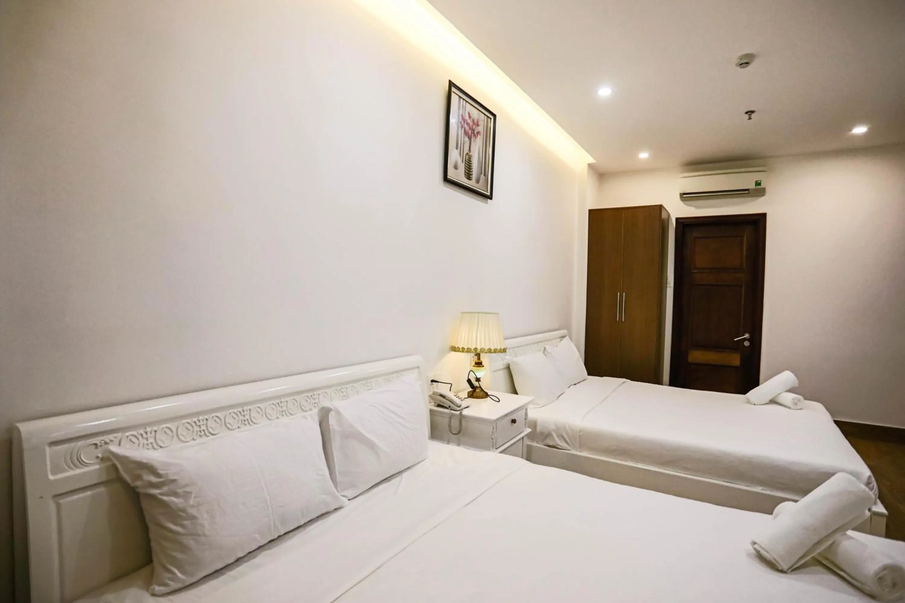 Bed in SeaColor Beachstay Danang Hotel by Haviland