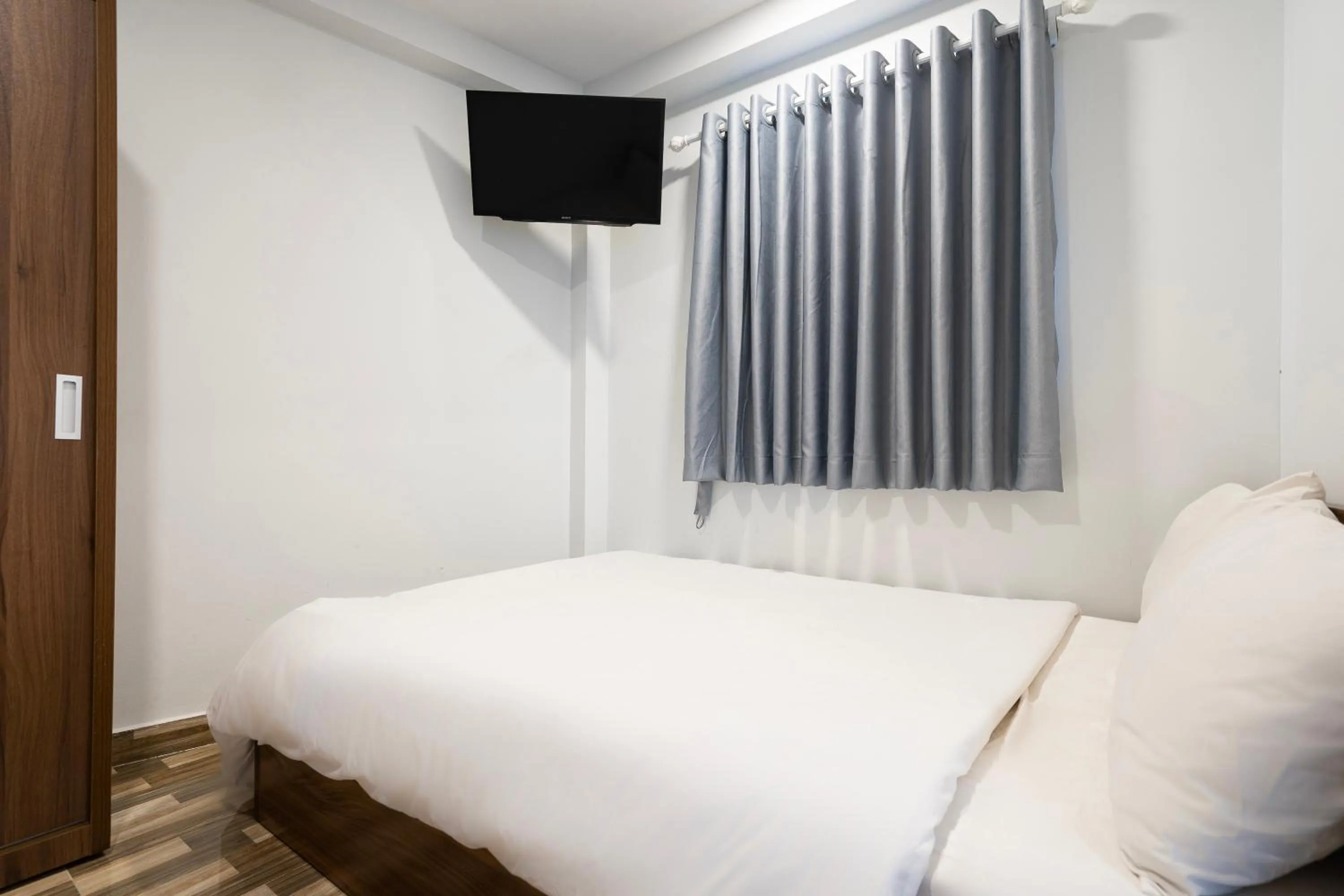 Bed in Ahu Hotel & Apartment