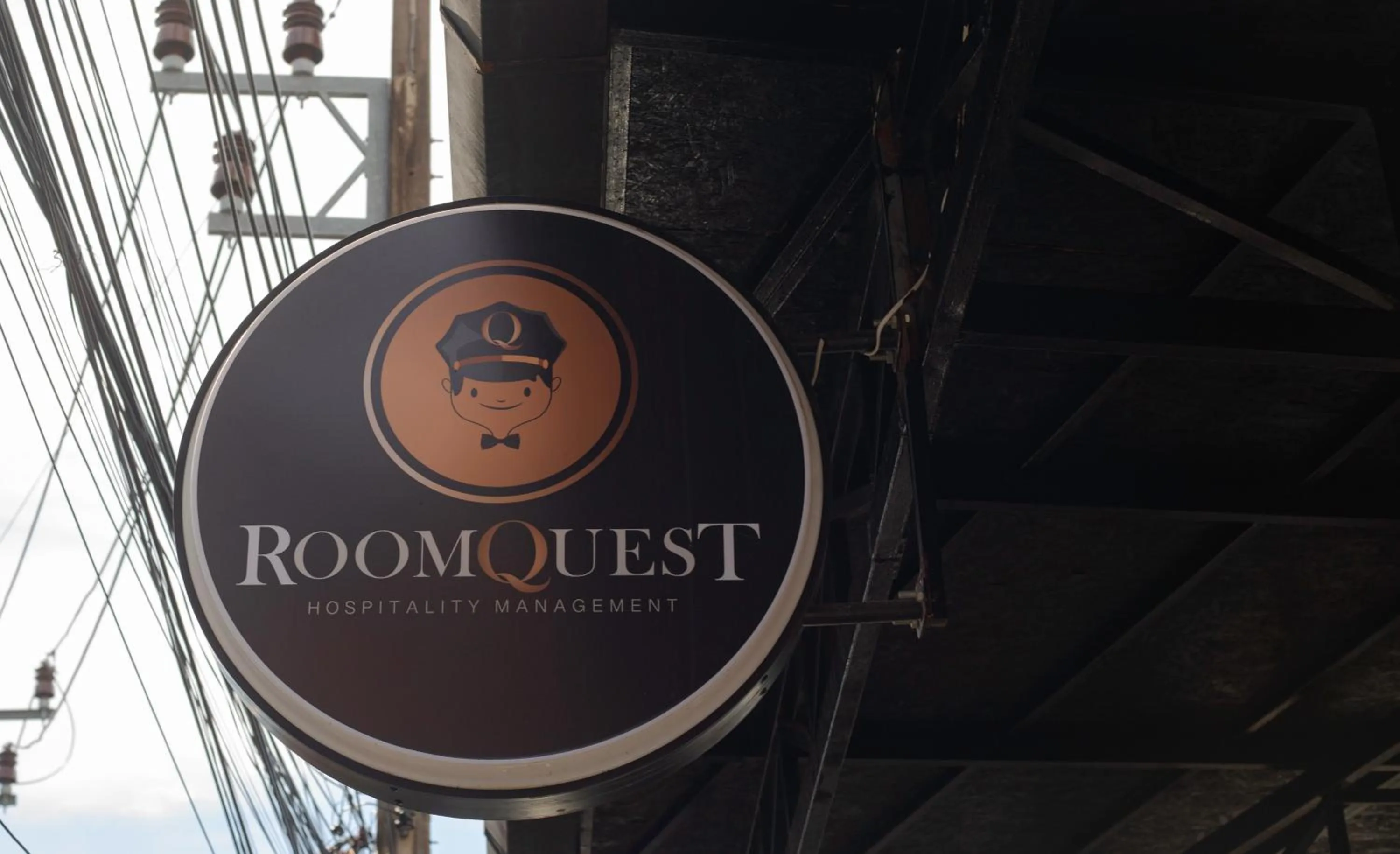 Logo/Certificate/Sign in RoomQuest Phuket Patong Beach