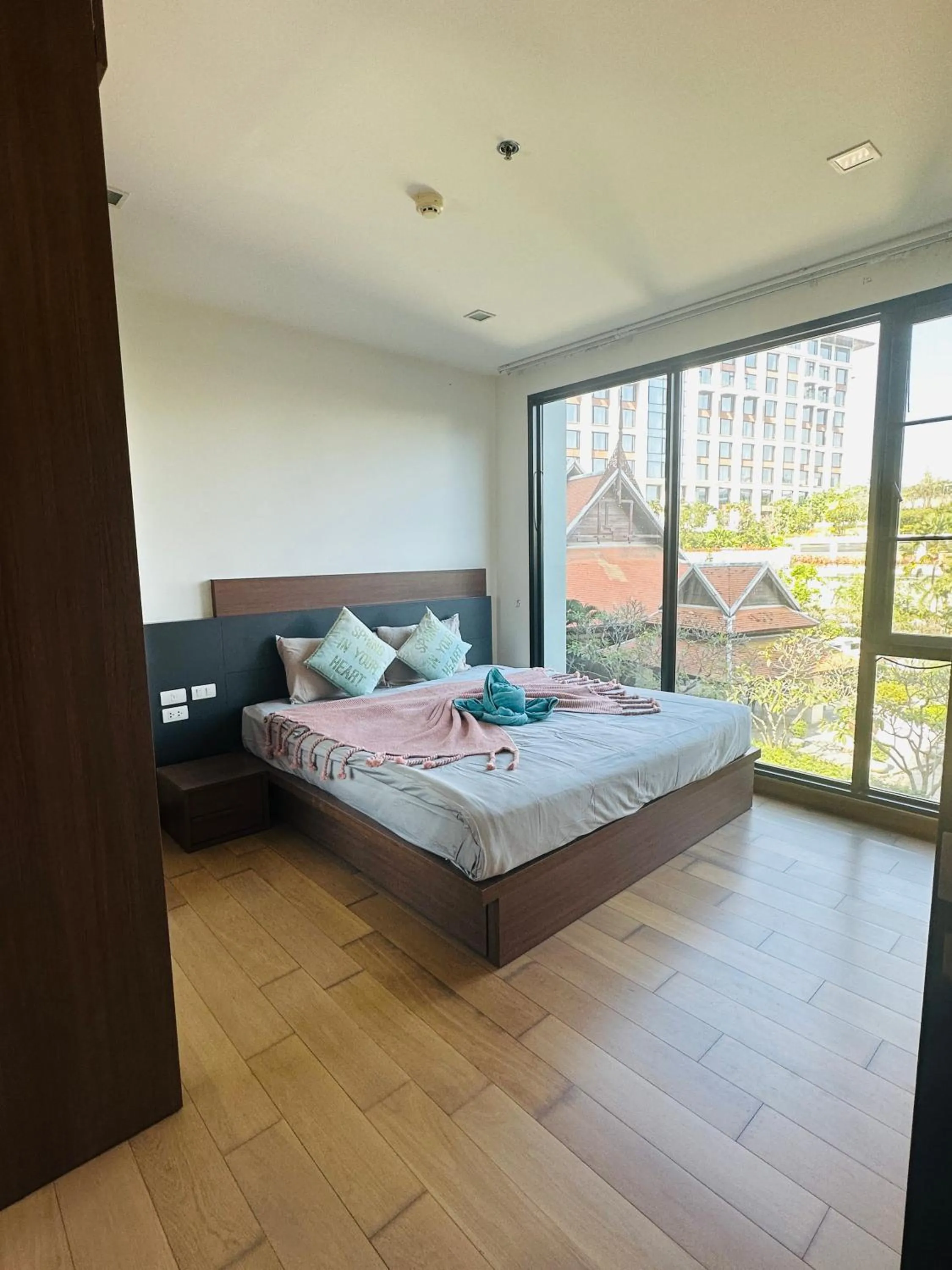 Bed in The Astra Condo Changkhlan in Chiang Mai