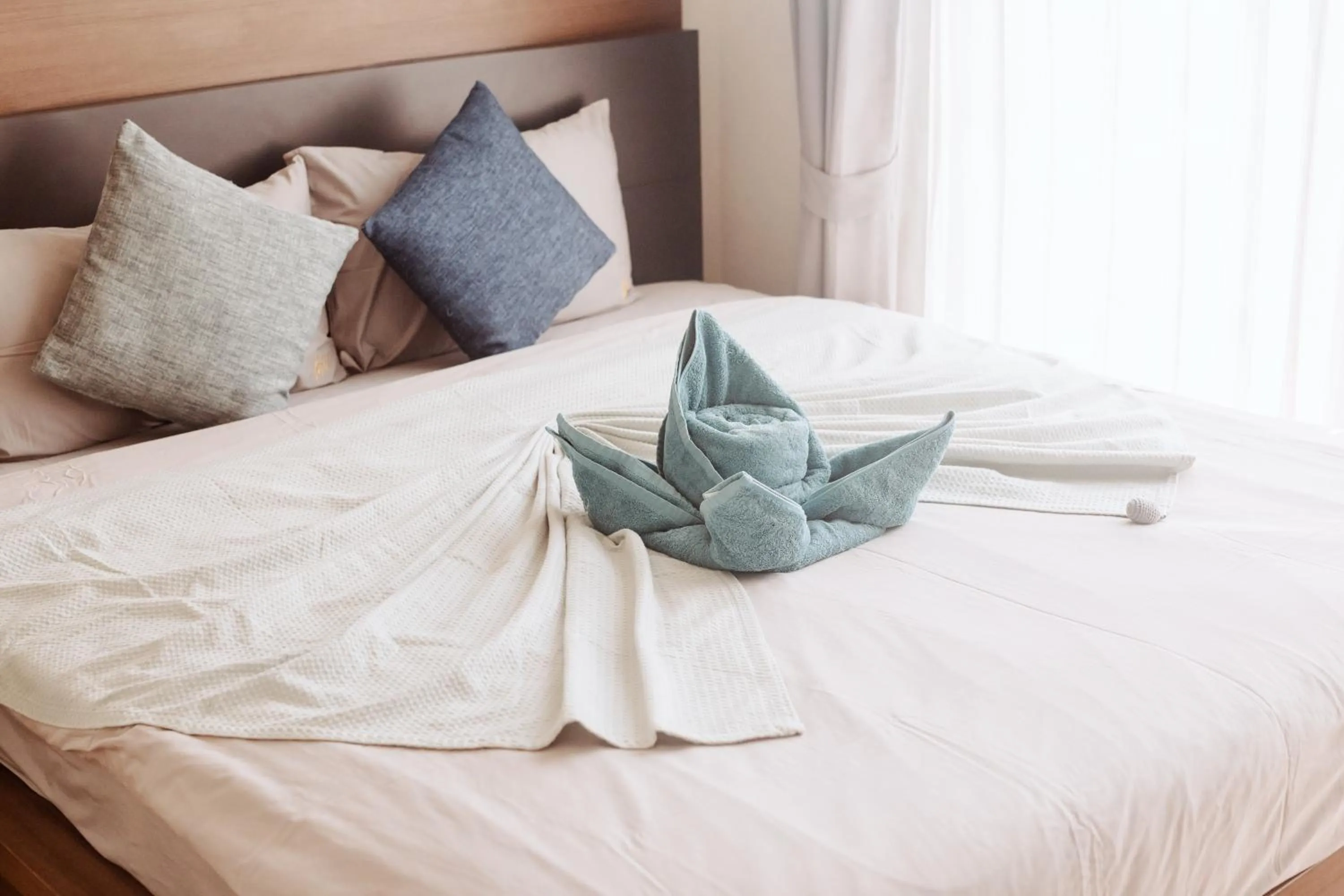 Bed in The Astra Condo Changkhlan in Chiang Mai