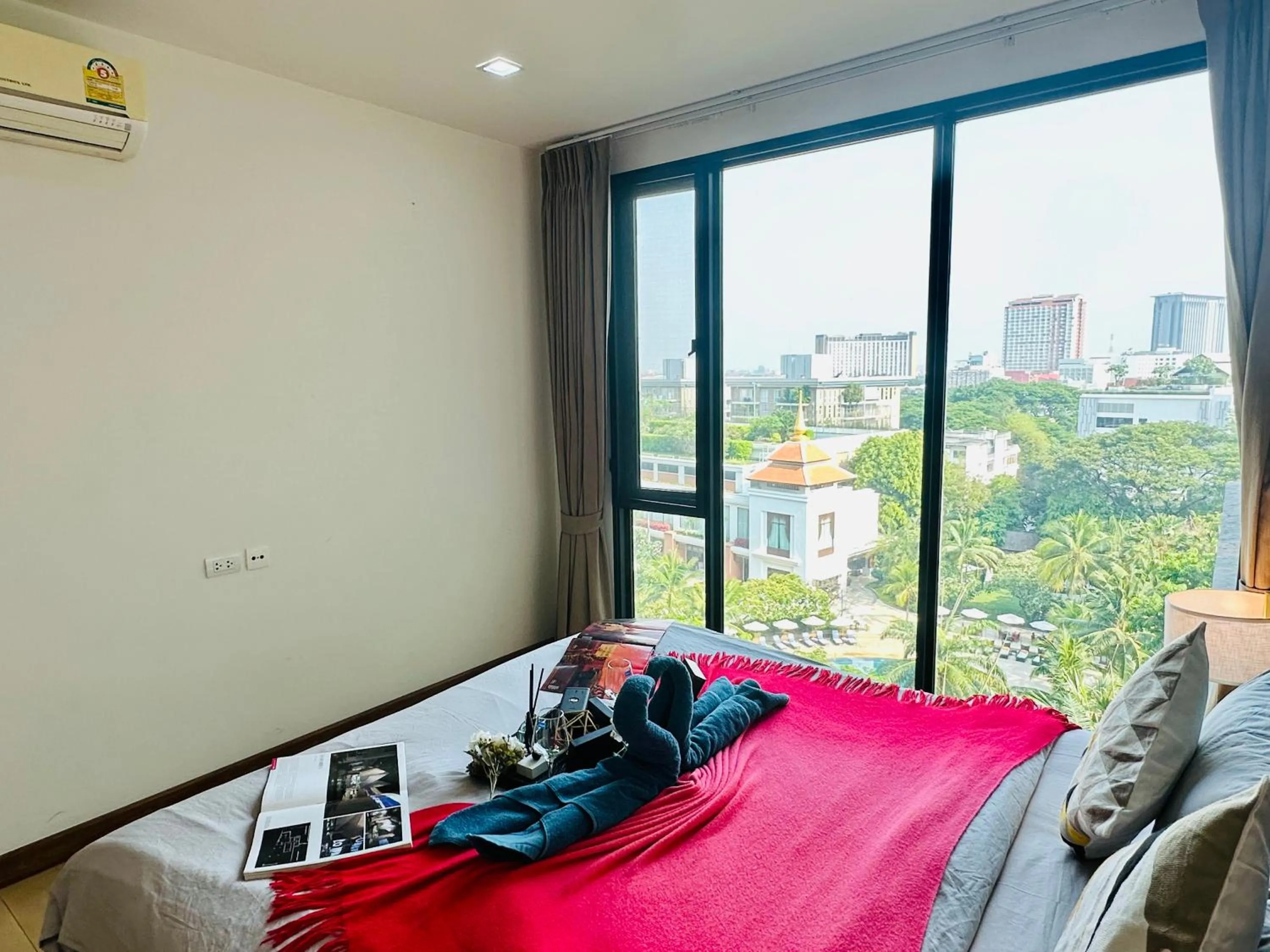 Bed in The Astra Condo Changkhlan in Chiang Mai