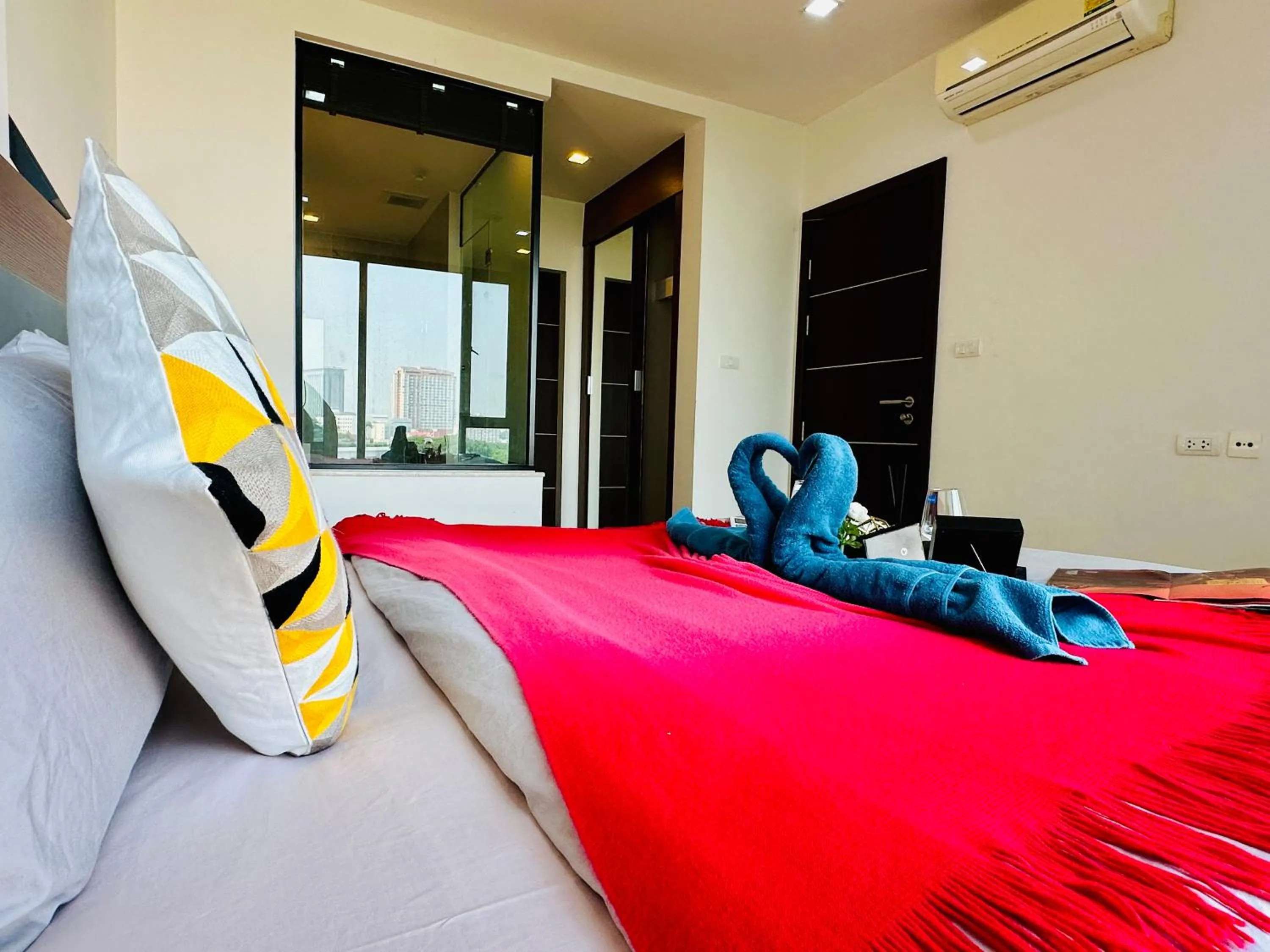 Bed in The Astra Condo Changkhlan in Chiang Mai