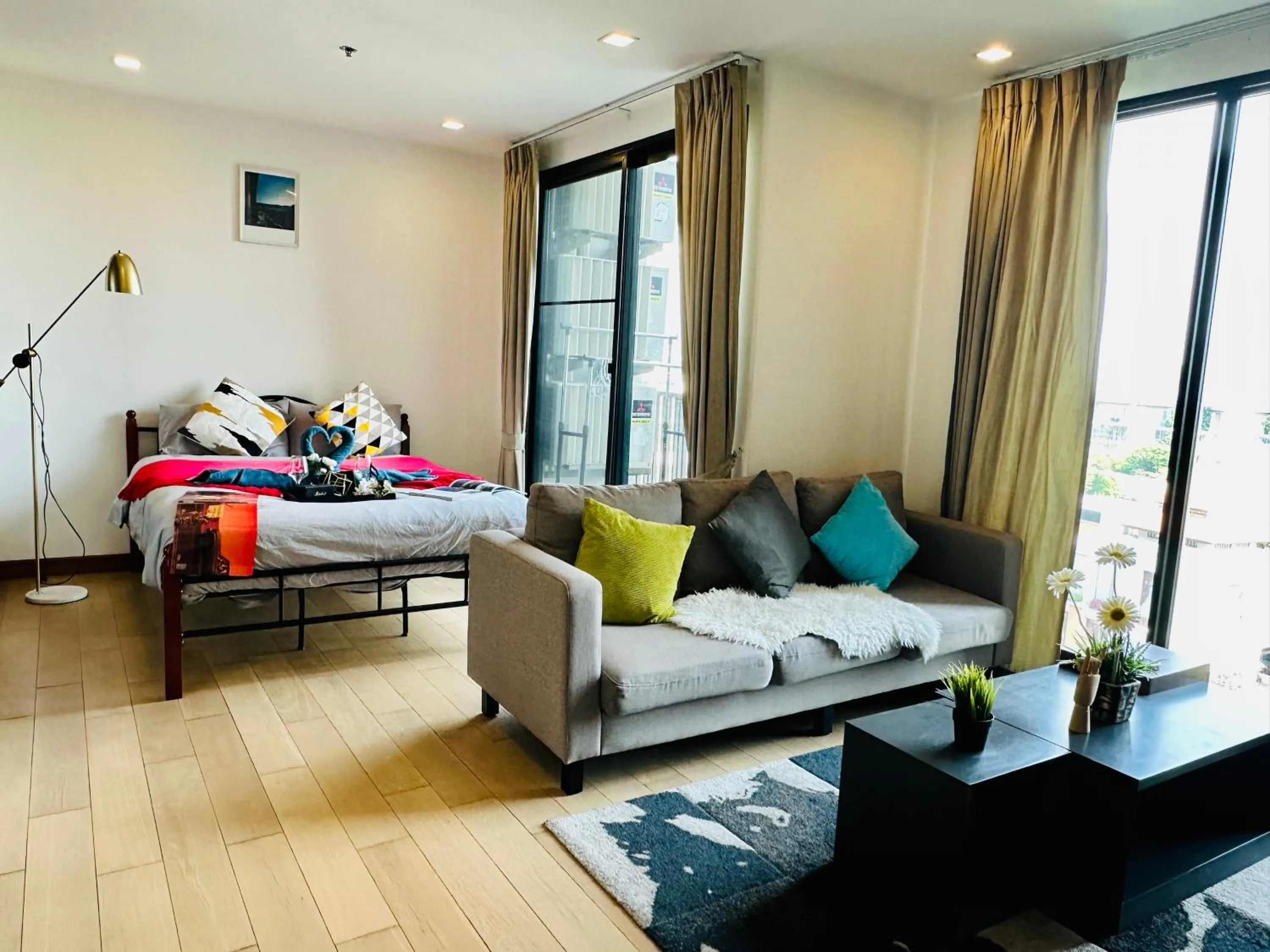 Bed in The Astra Condo Changkhlan in Chiang Mai