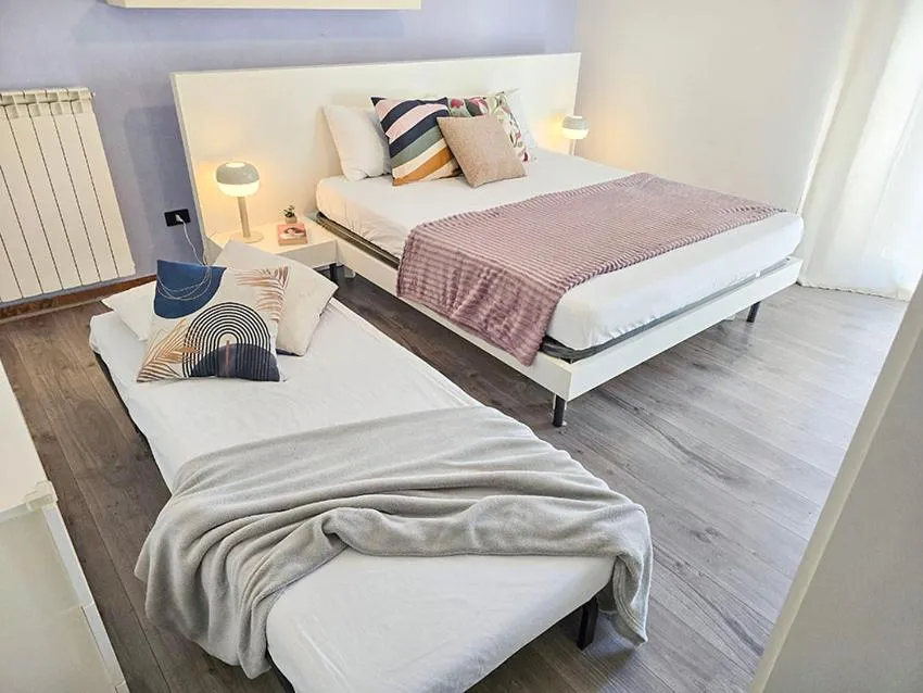 Bed in Ampio Quadrilocale 8 Pax vista mare