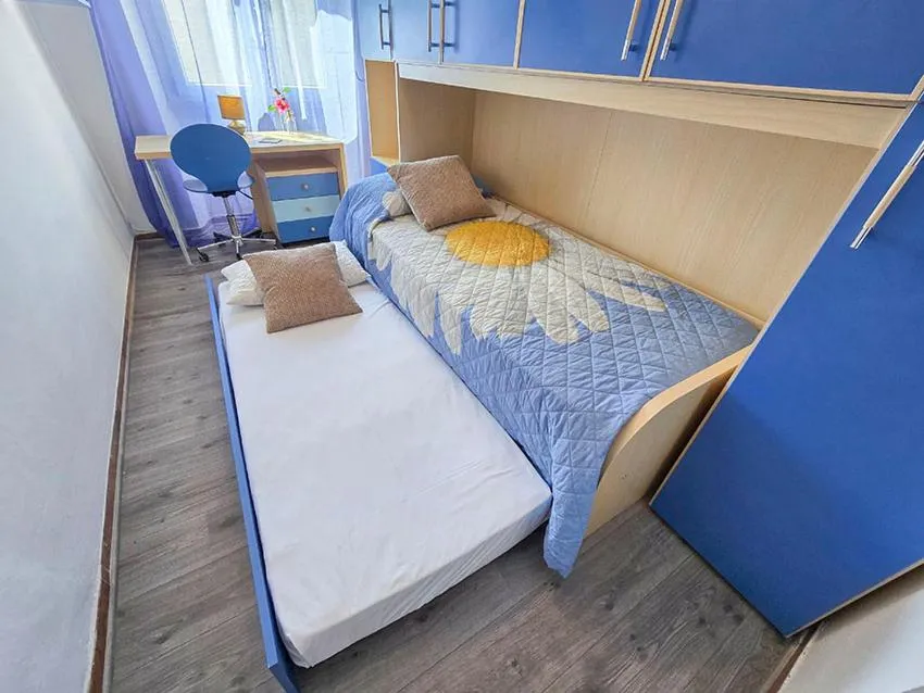 Bed in Ampio Quadrilocale 8 Pax vista mare