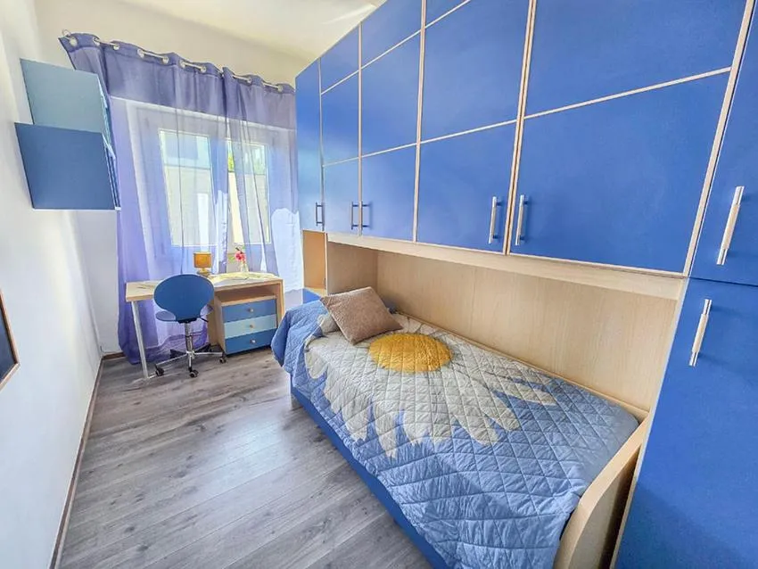 Bed in Ampio Quadrilocale 8 Pax vista mare