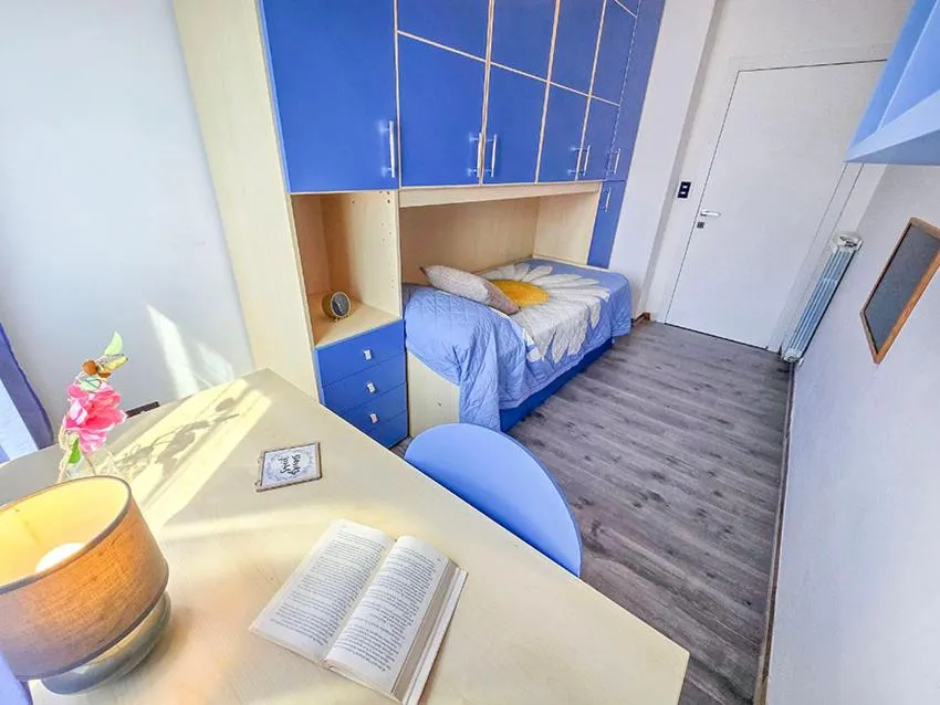Bed in Ampio Quadrilocale 8 Pax vista mare