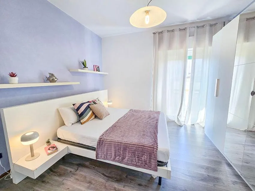 Bed in Ampio Quadrilocale 8 Pax vista mare