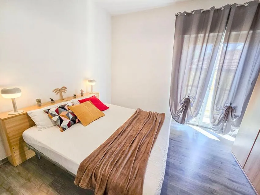 Bed in Ampio Quadrilocale 8 Pax vista mare