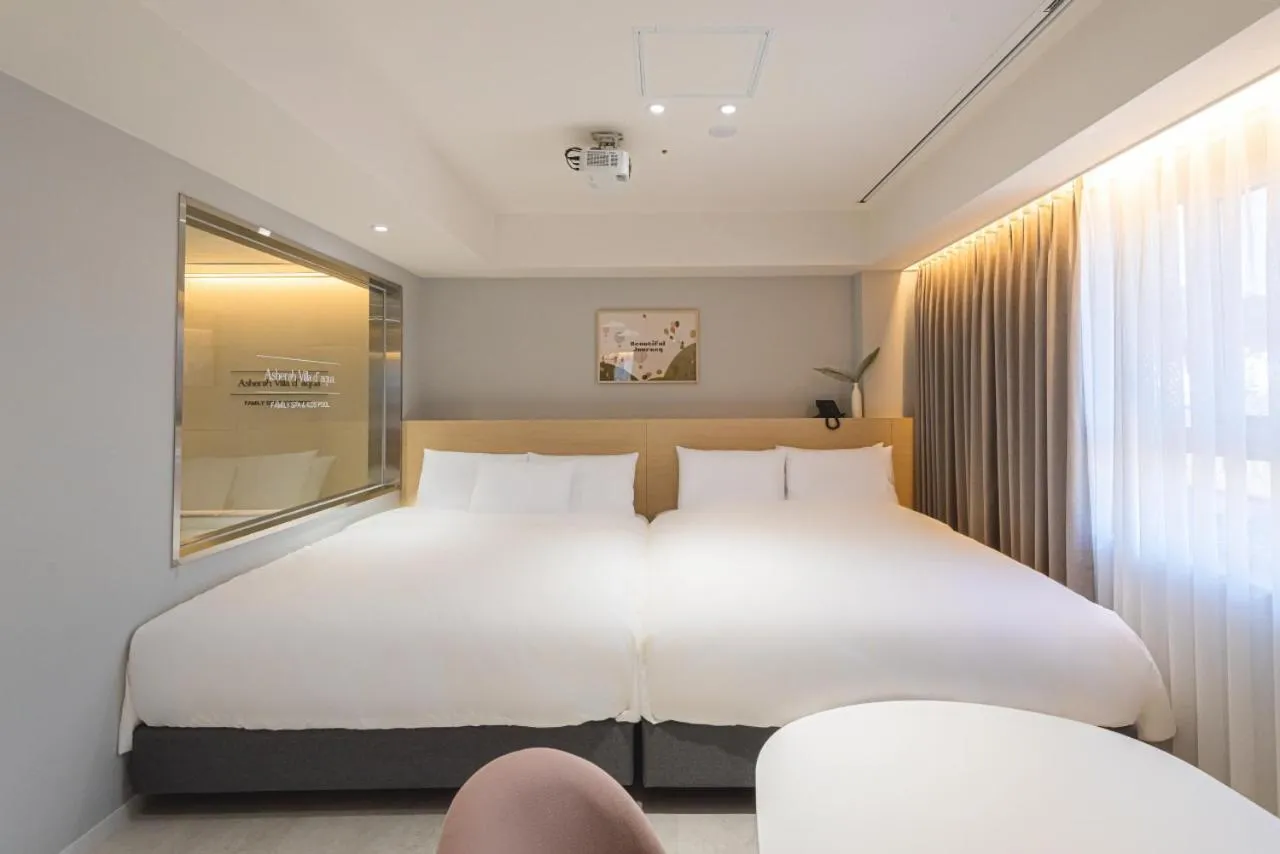 Bed in Asherah Villa d' aqua Hotel