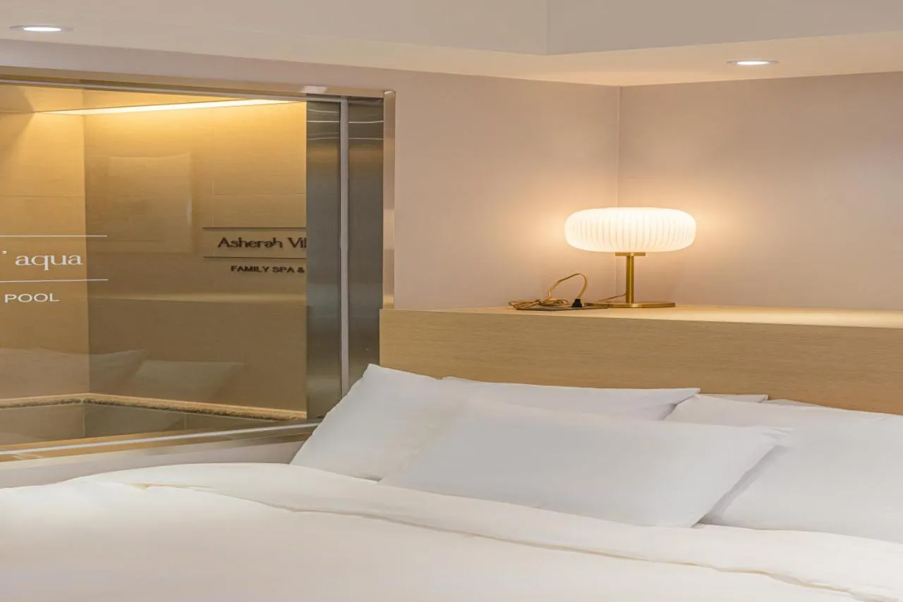 Bed in Asherah Villa d' aqua Hotel