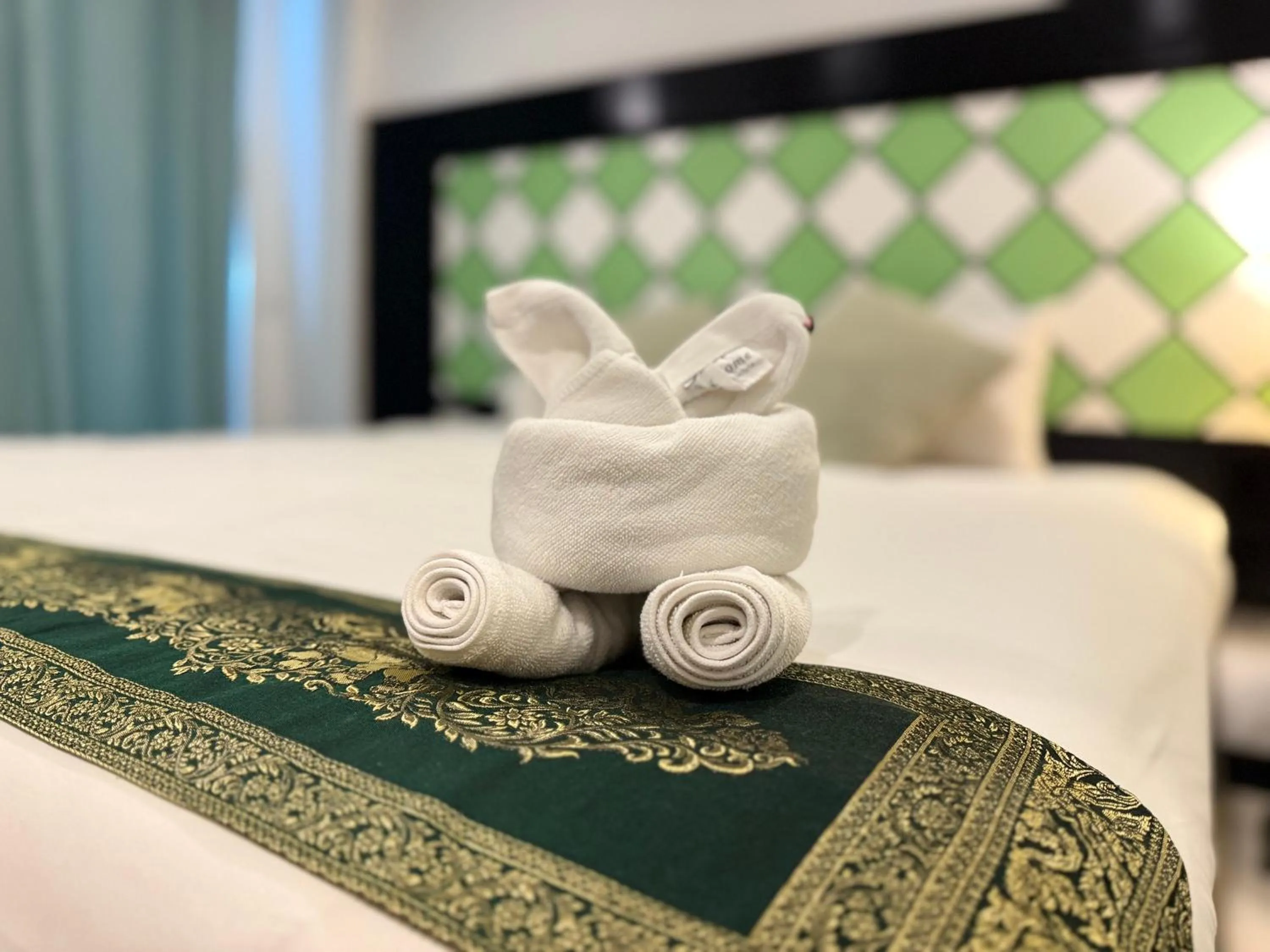 towels, Bed in COZY Residence Patong