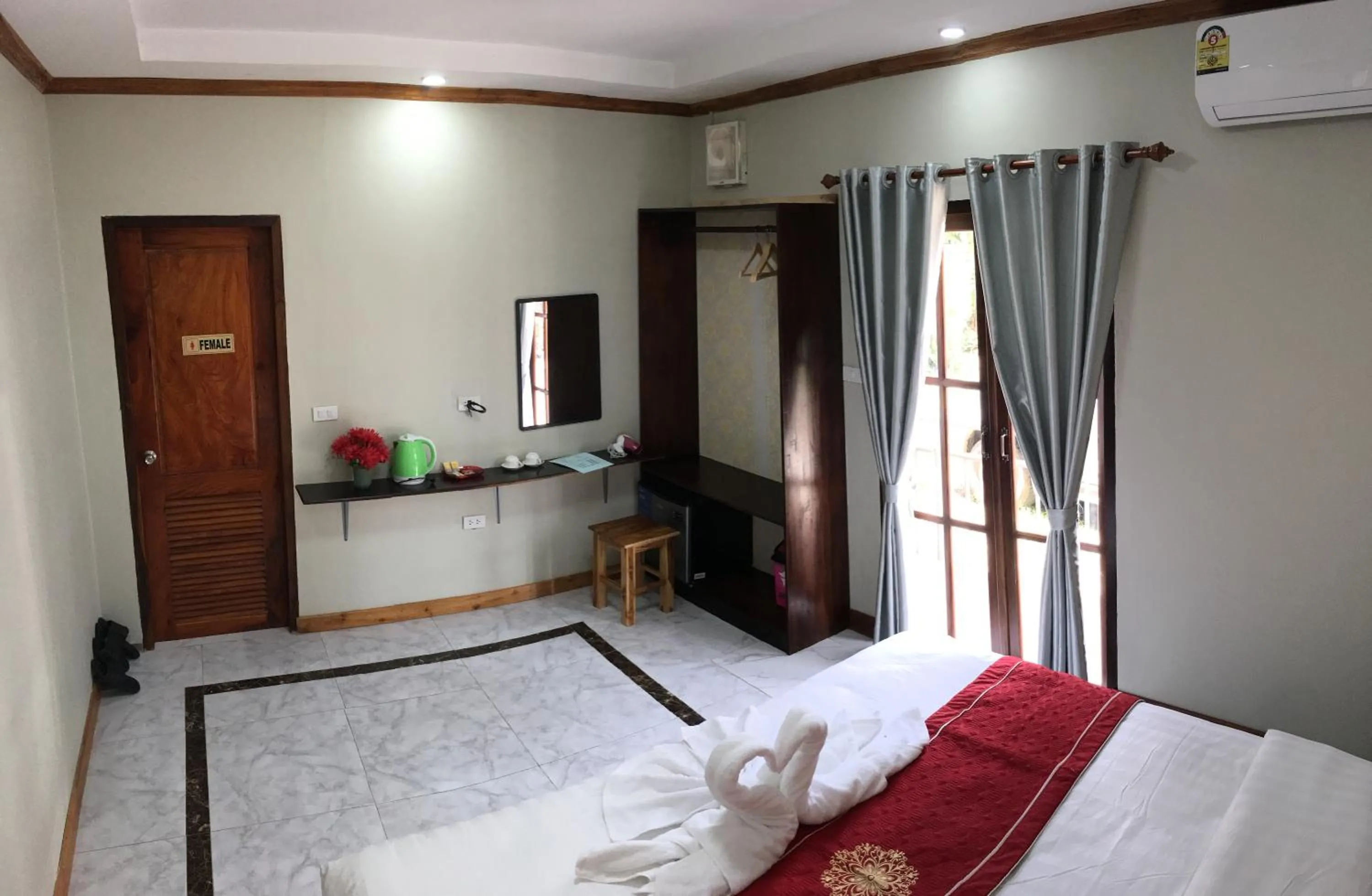 Bed in Le KhounSok Boutique Hotel