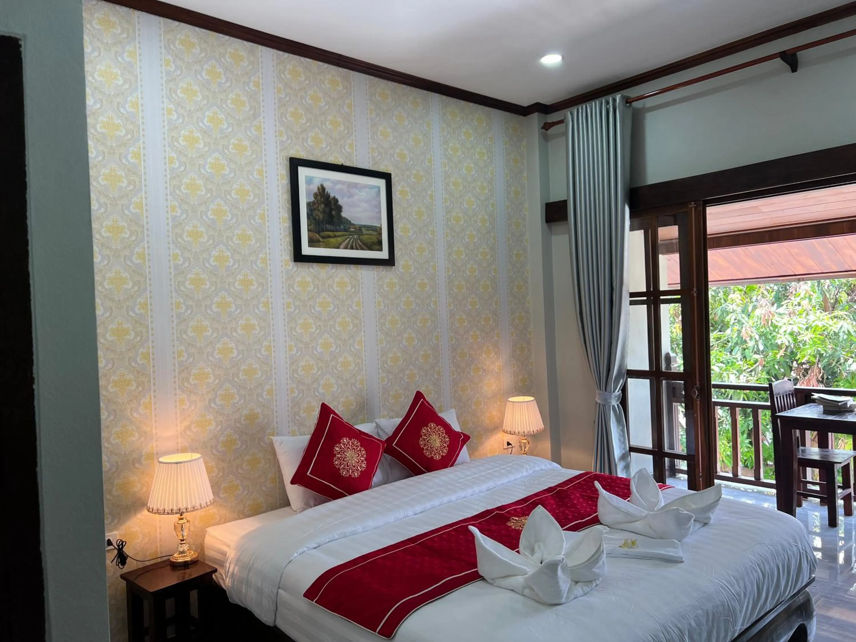 Bed in Le KhounSok Boutique Hotel