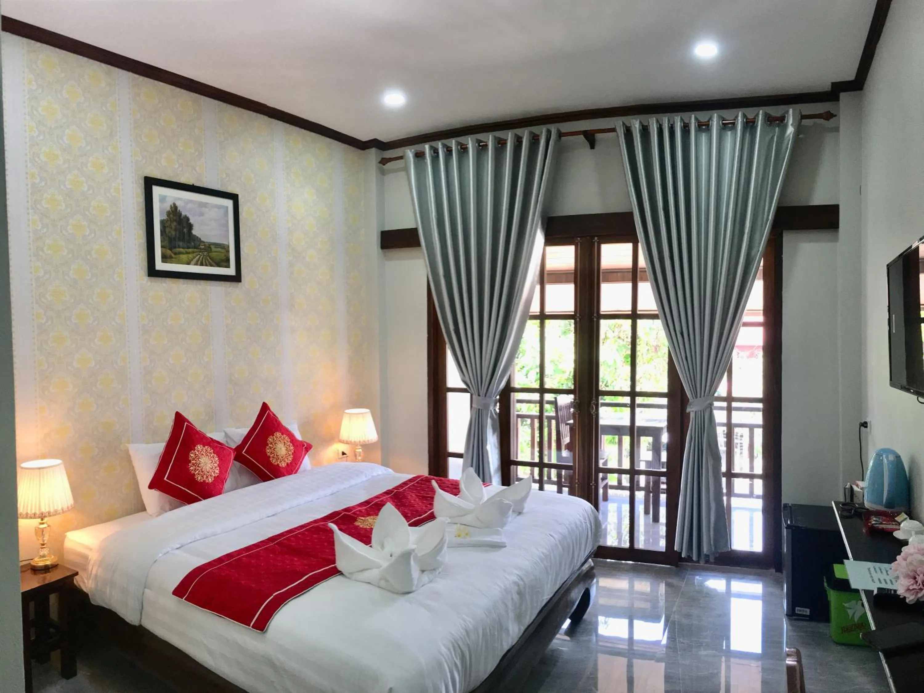 Bed in Le KhounSok Boutique Hotel