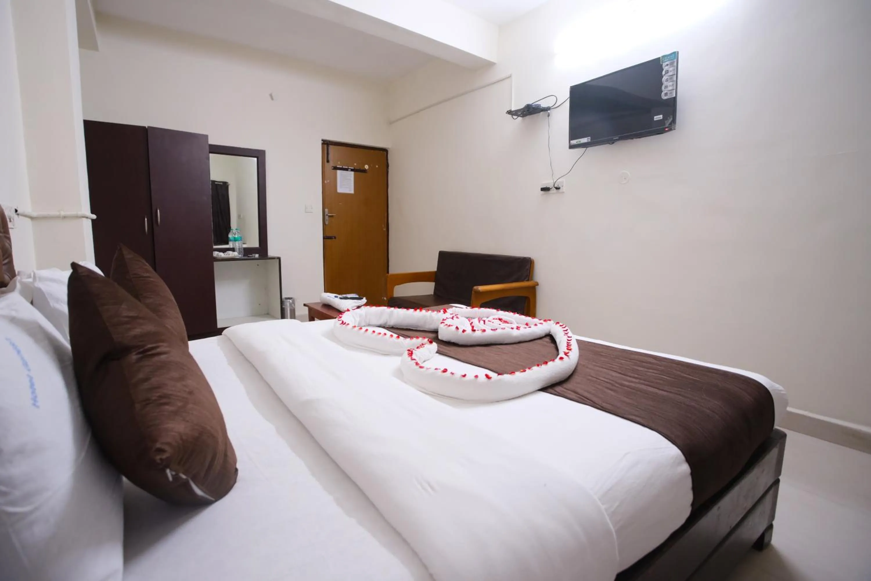 Bed in Ganesh Guest House