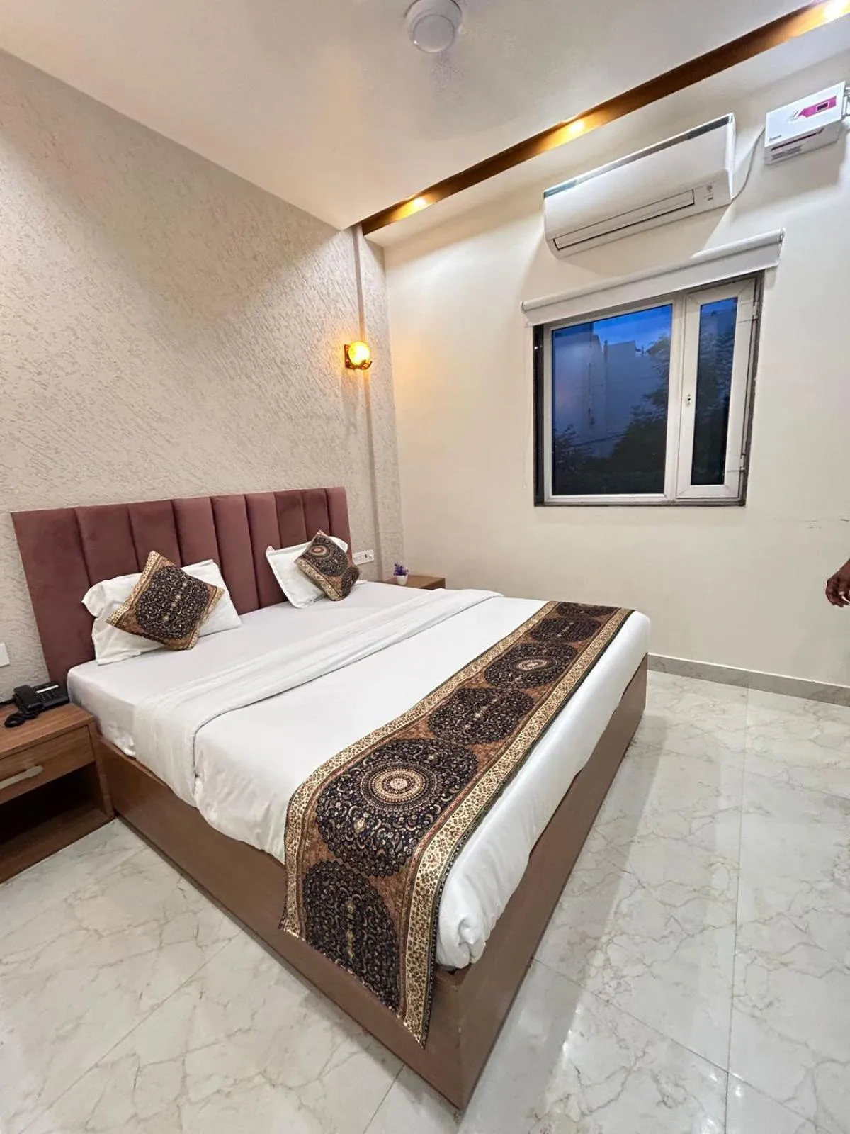 Bed in Hotel Satsang Grand