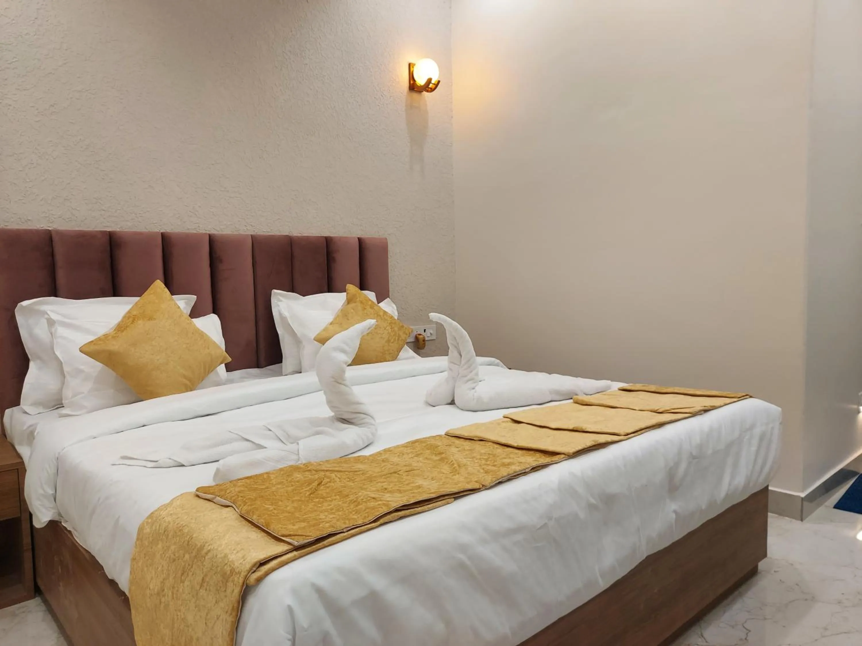 Bed in Hotel Satsang Grand