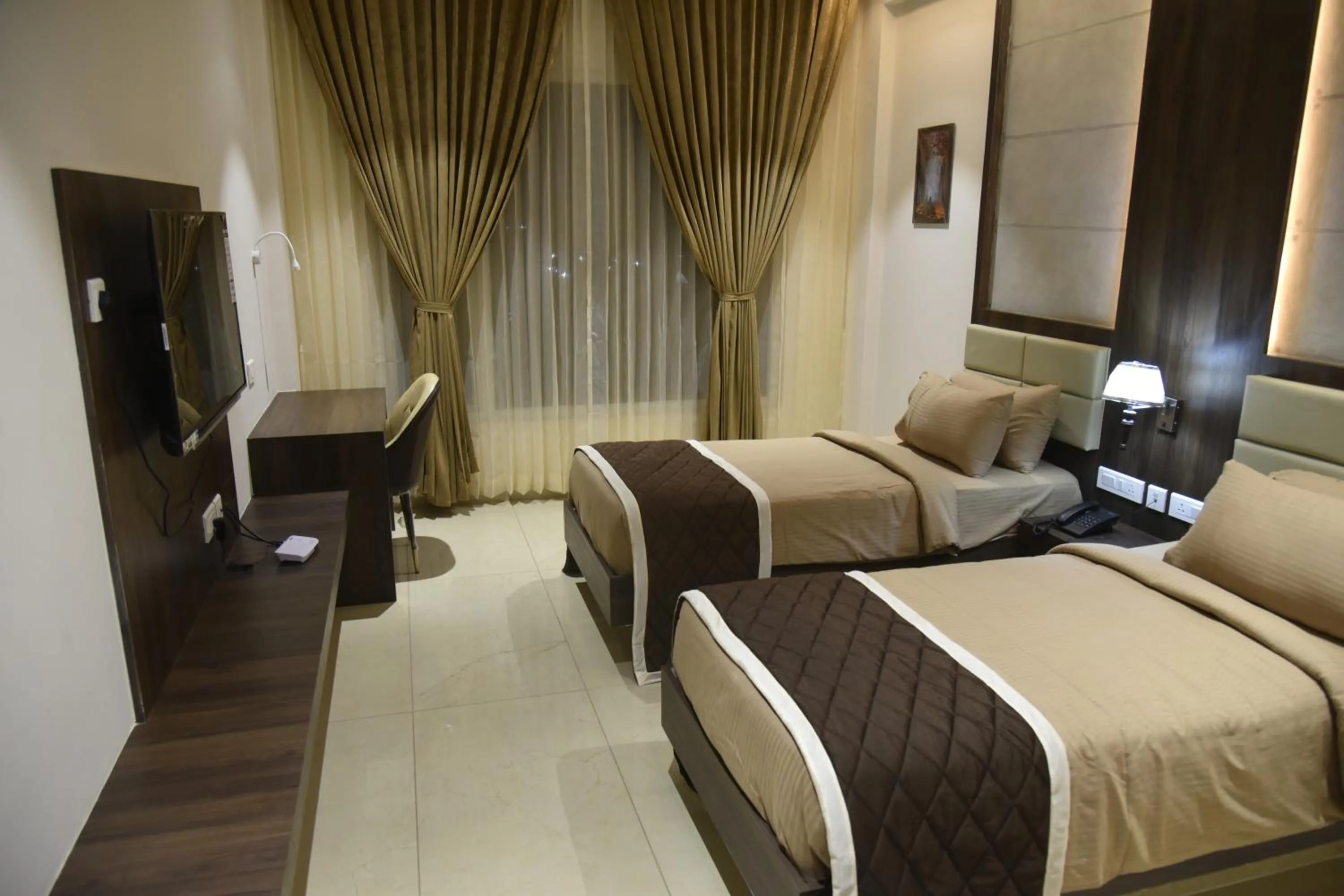 Bed in HOTEL VAHINI GRAND