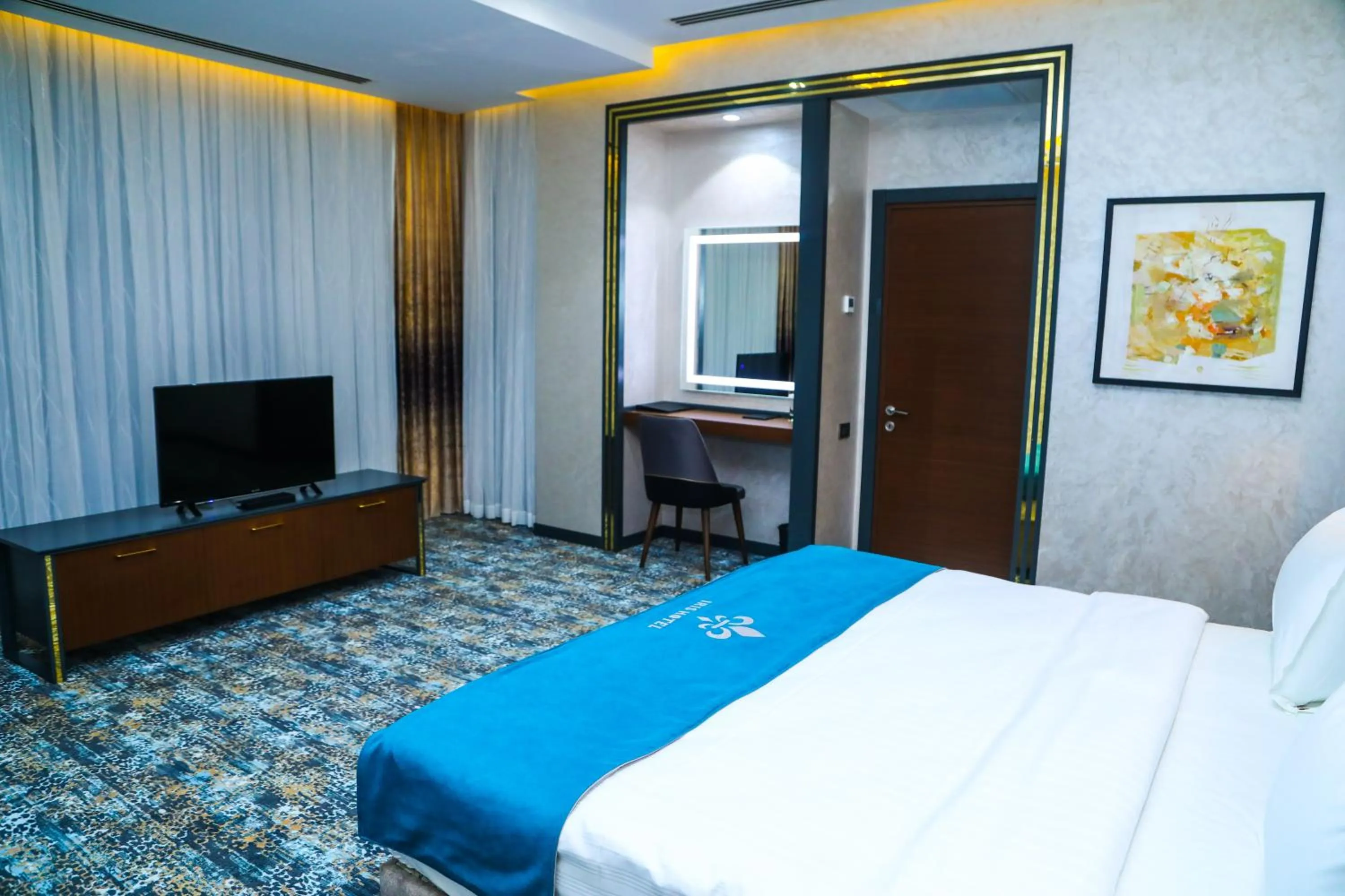 Communal lounge/ TV room, Bed in Iris Hotel Baku