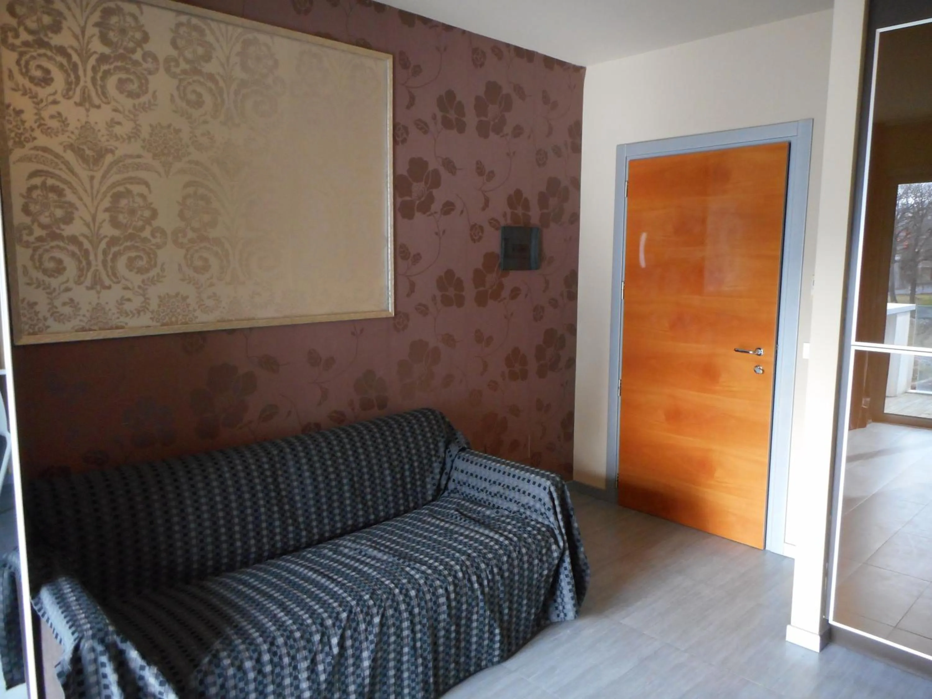 Living room, Bed in Residence San Marino