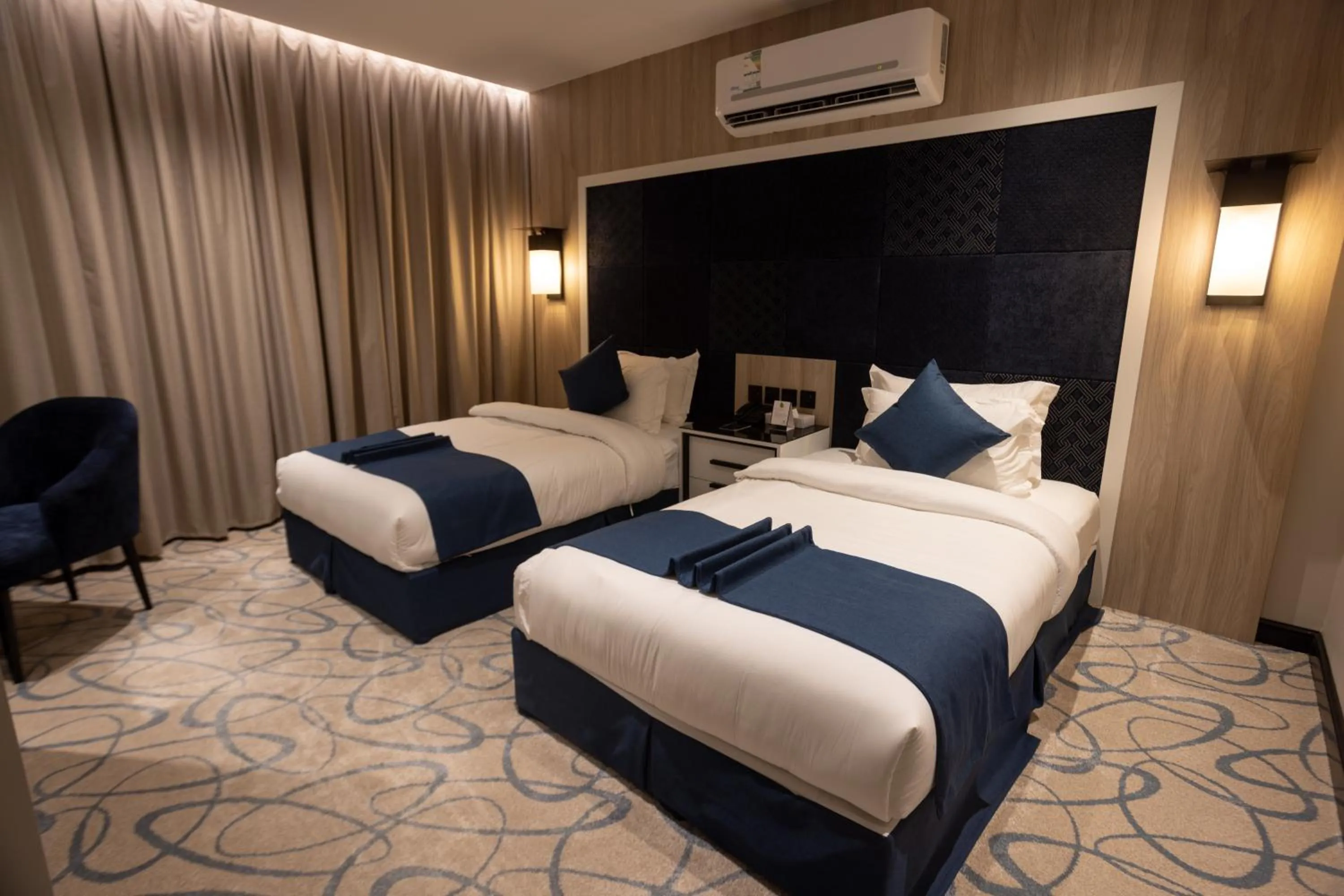 Bed in Skyline Hotel & Suites