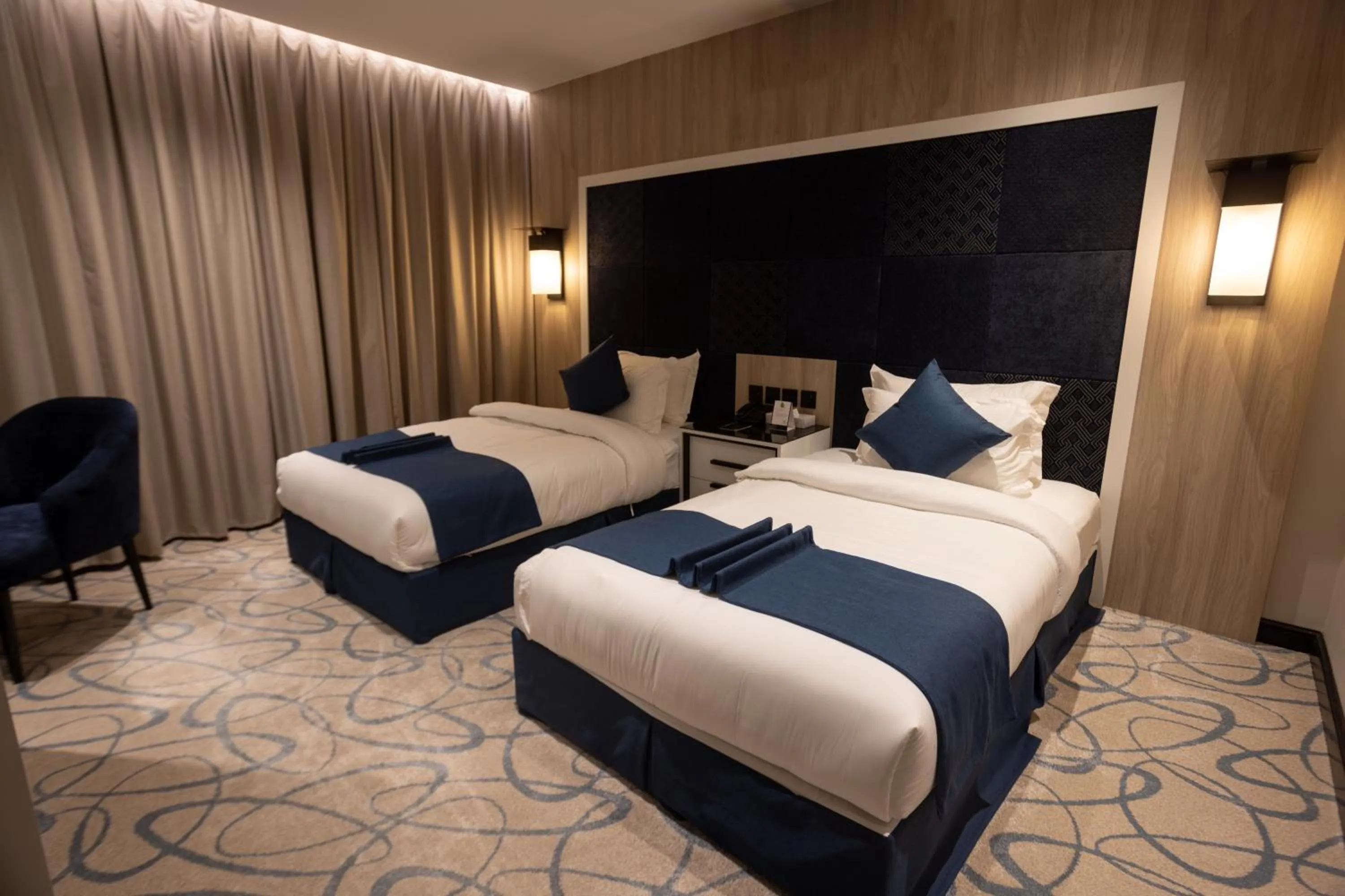 Bed in Skyline Hotel & Suites