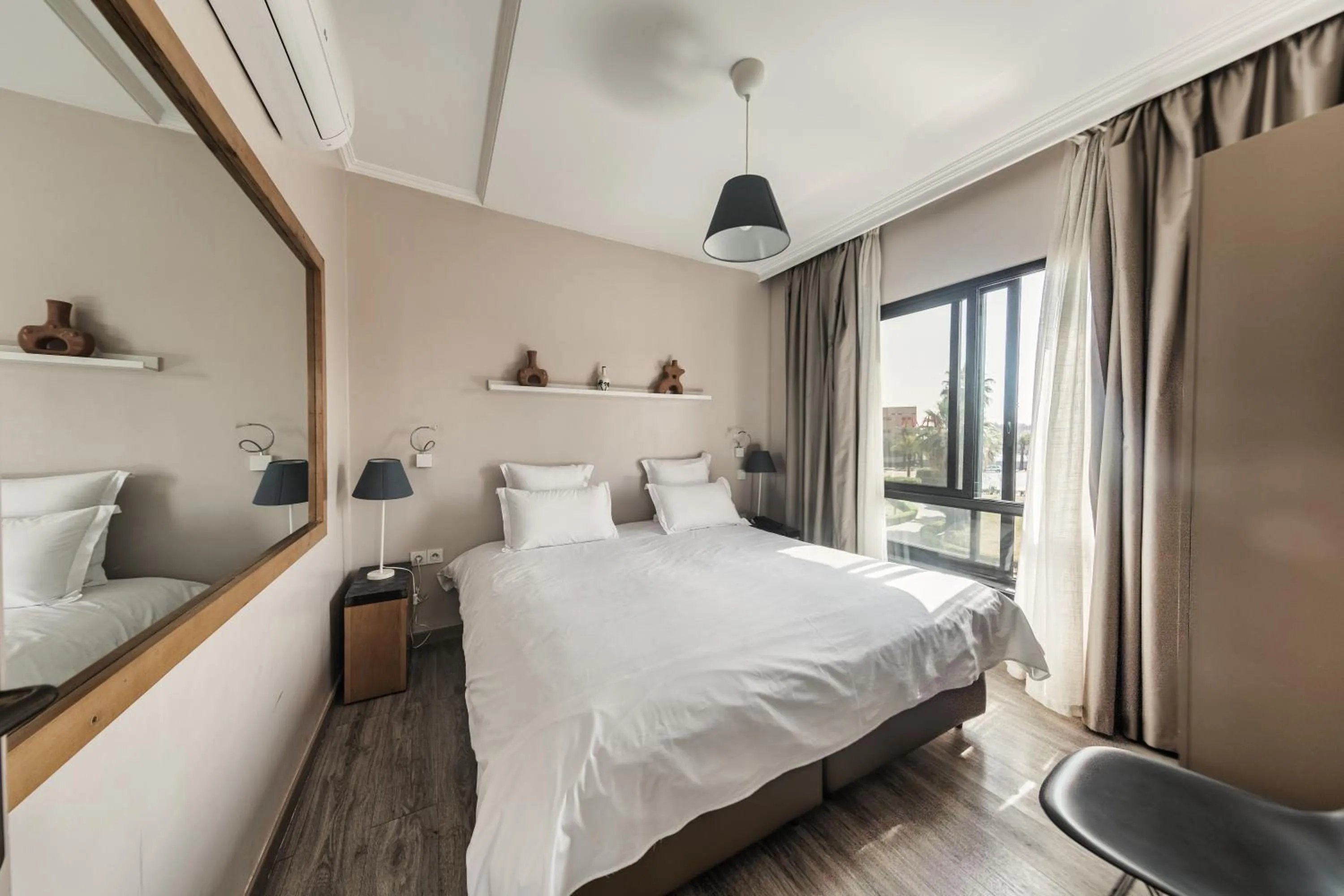 Bed in Amani Hotel Suites & Spa