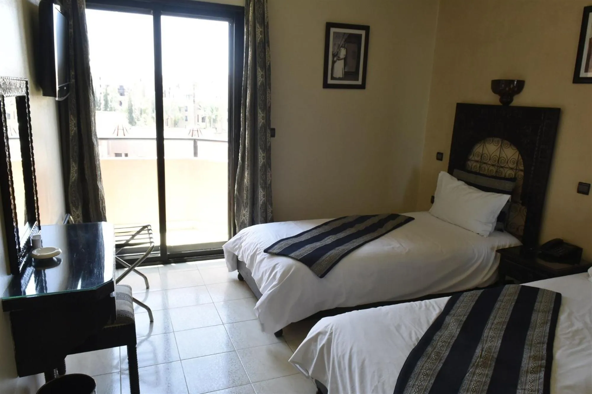 Bed in Amani Hotel Suites & Spa