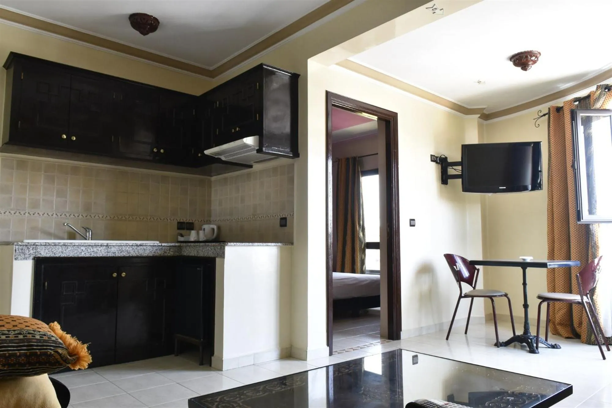 Communal lounge/ TV room in Amani Hotel Suites & Spa