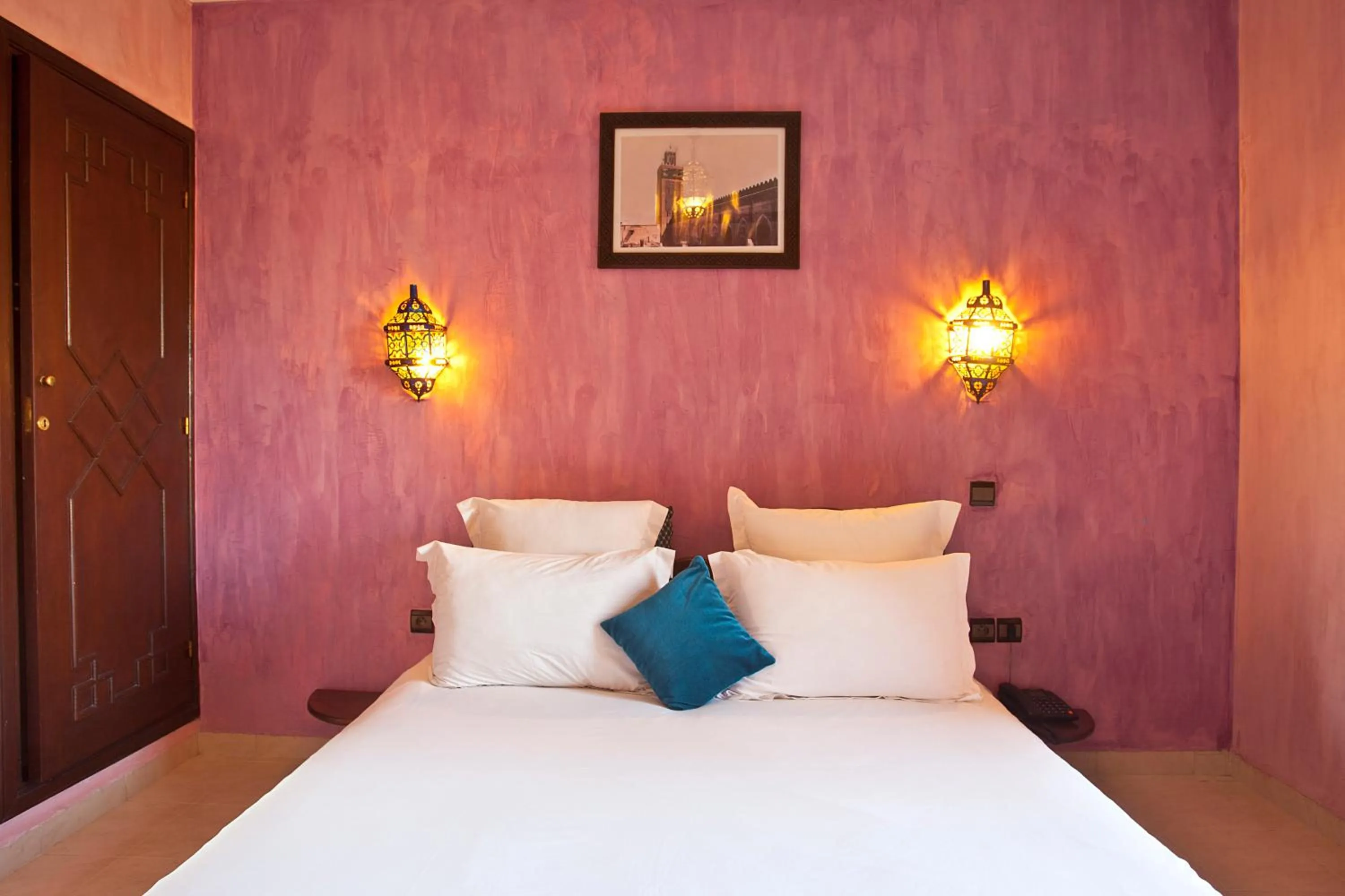 Bed in Amani Hotel Suites & Spa