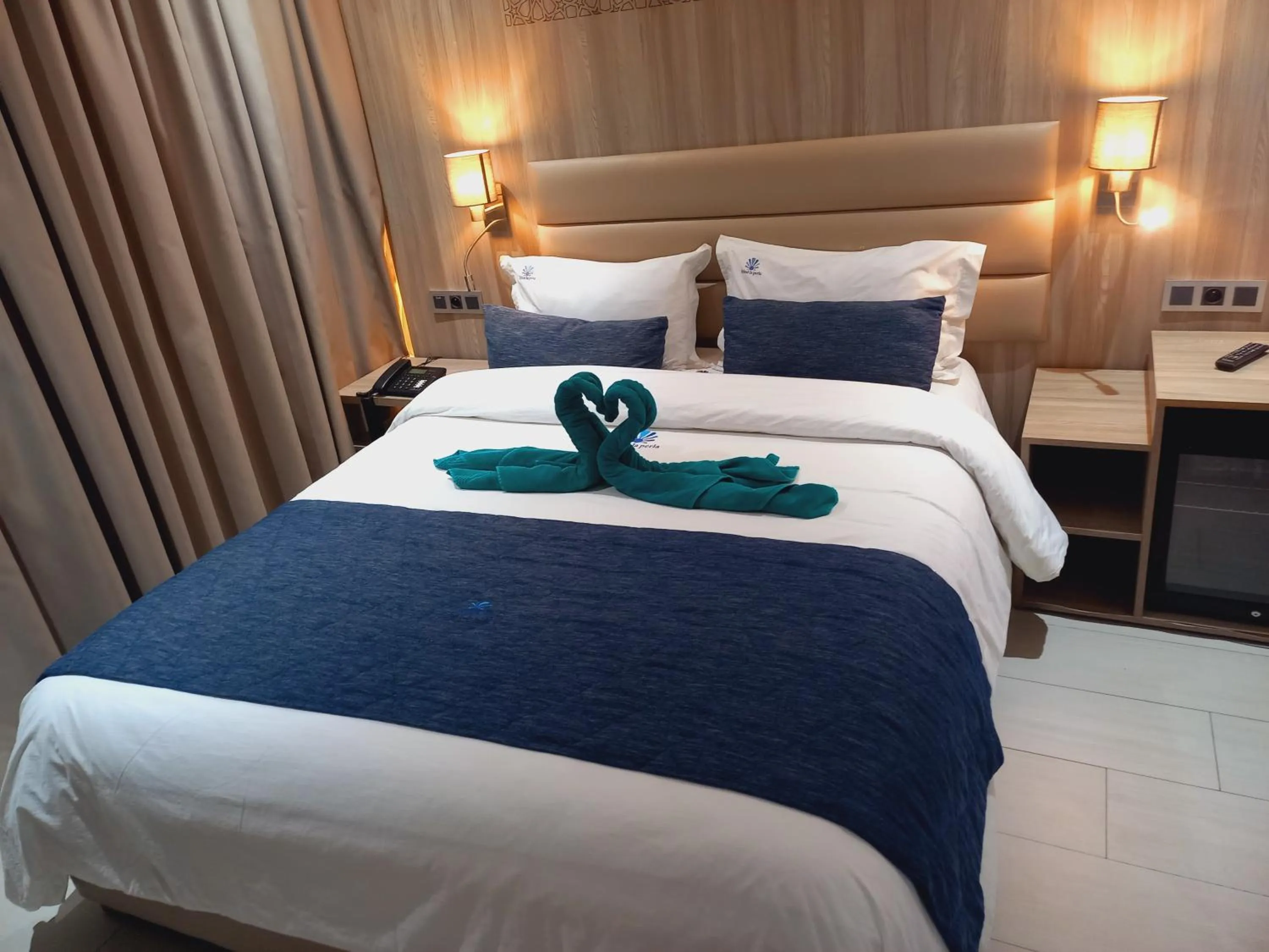 Bed in Hôtel La Perla