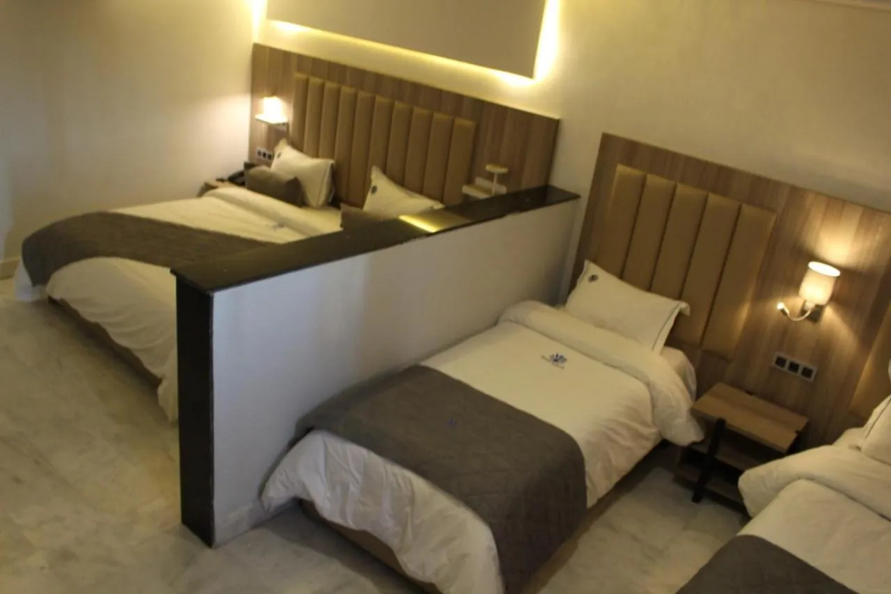 Bed in Hôtel La Perla