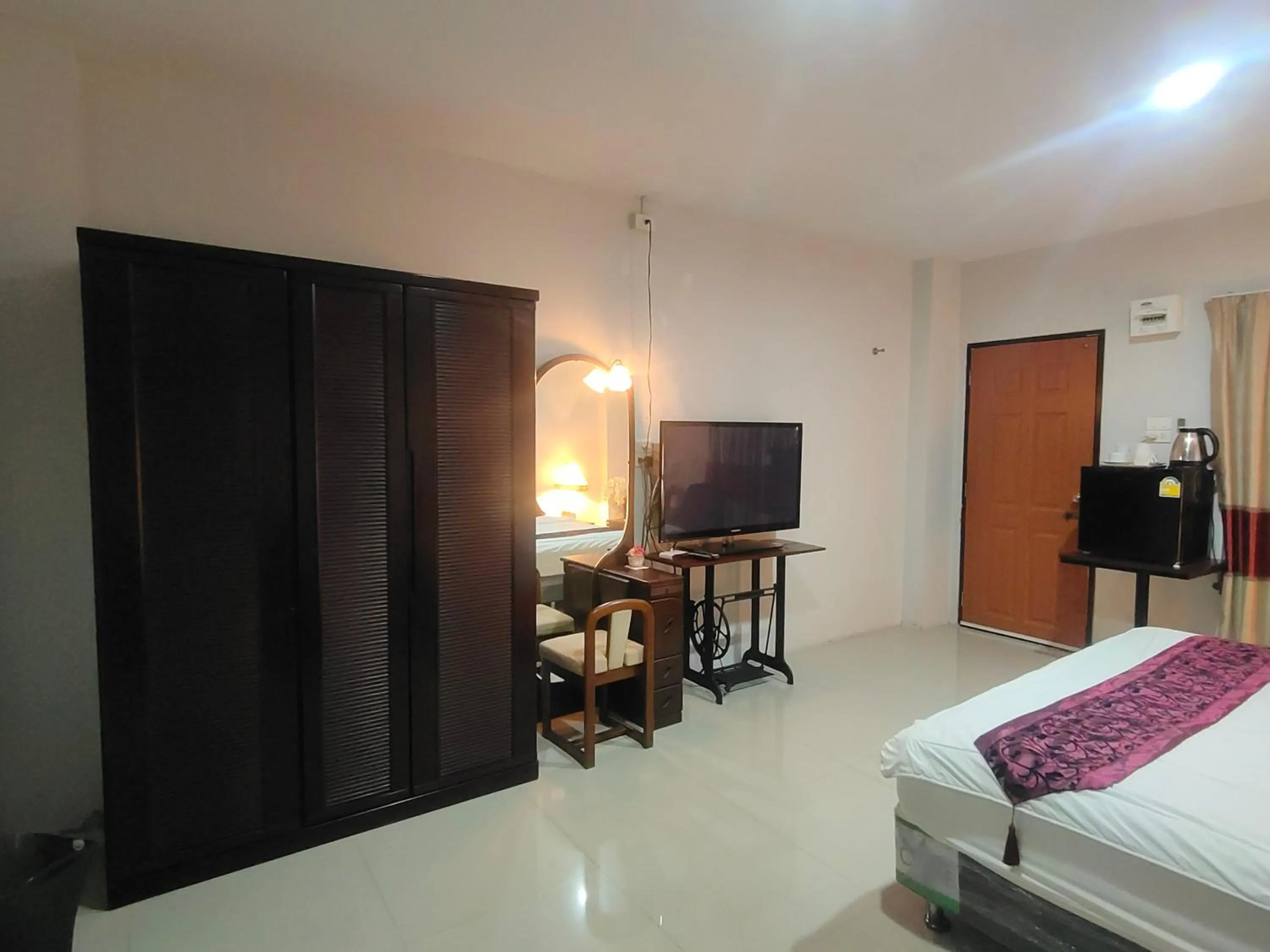 Bed in ห้องพักนครราชสีมา The Rich Room