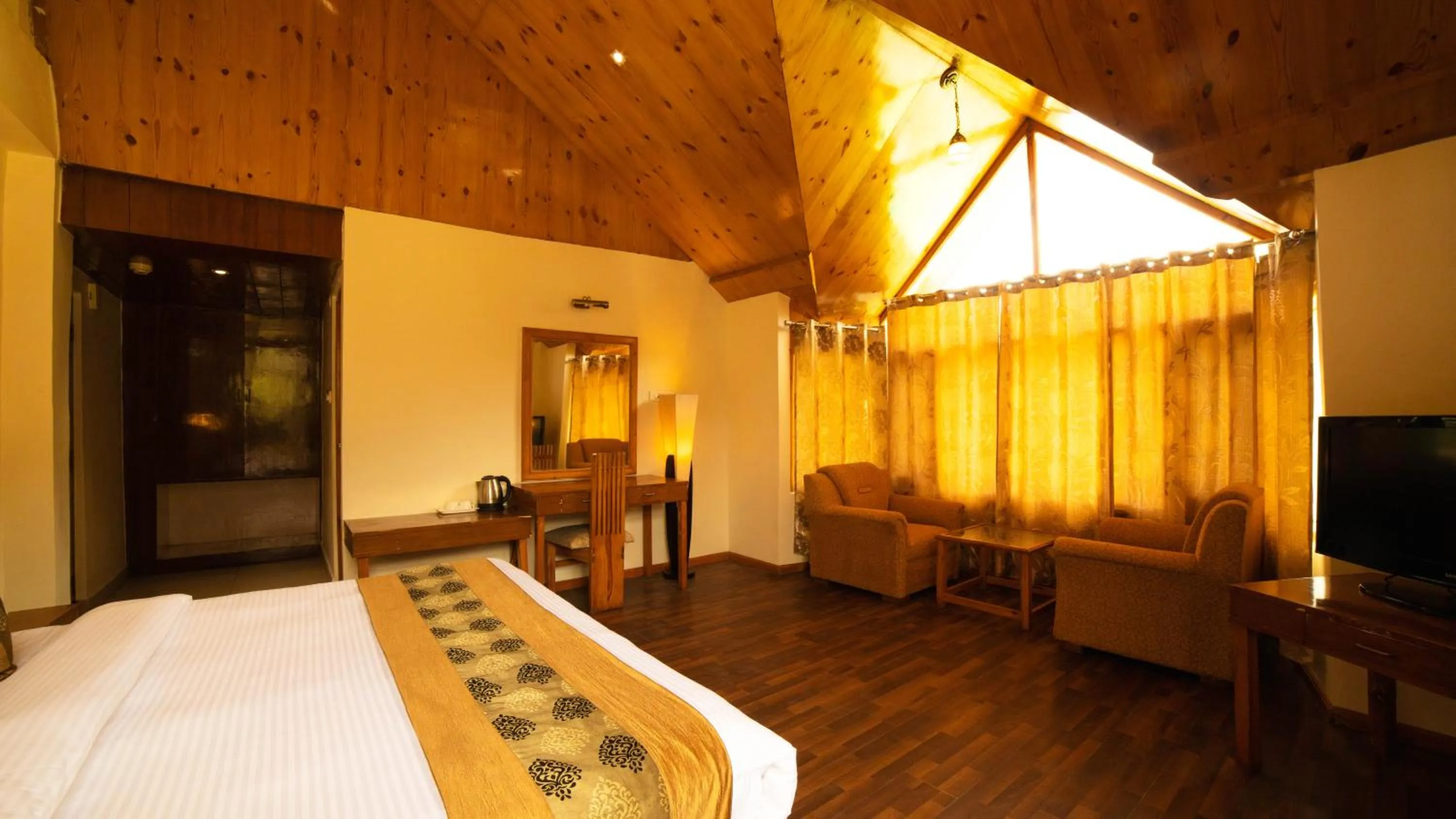 Bed in Vaayu Resorts And Spa