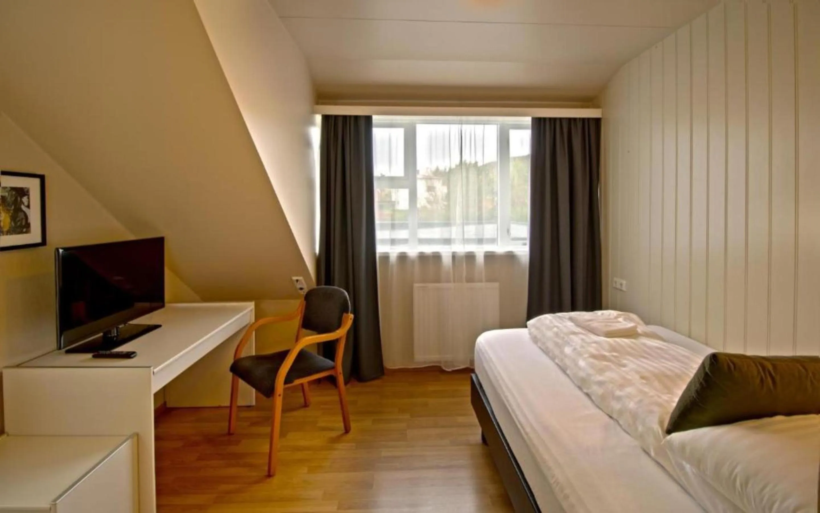 Photo of the whole room, Bed in Hotel Breiddalsvik