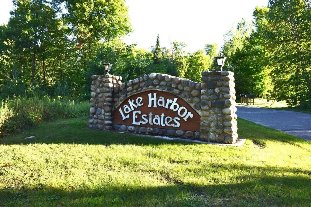 Property logo or sign in Spacious Leech Lake Home on 2 Private Acres, 200' of lake shore 15 Minutes to Walker with boat lift, dock, swimming, fire pit