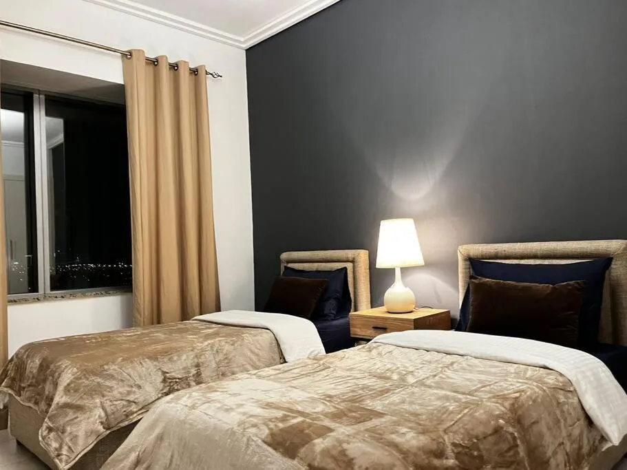 Bed in Chic 3 bedroom apartment