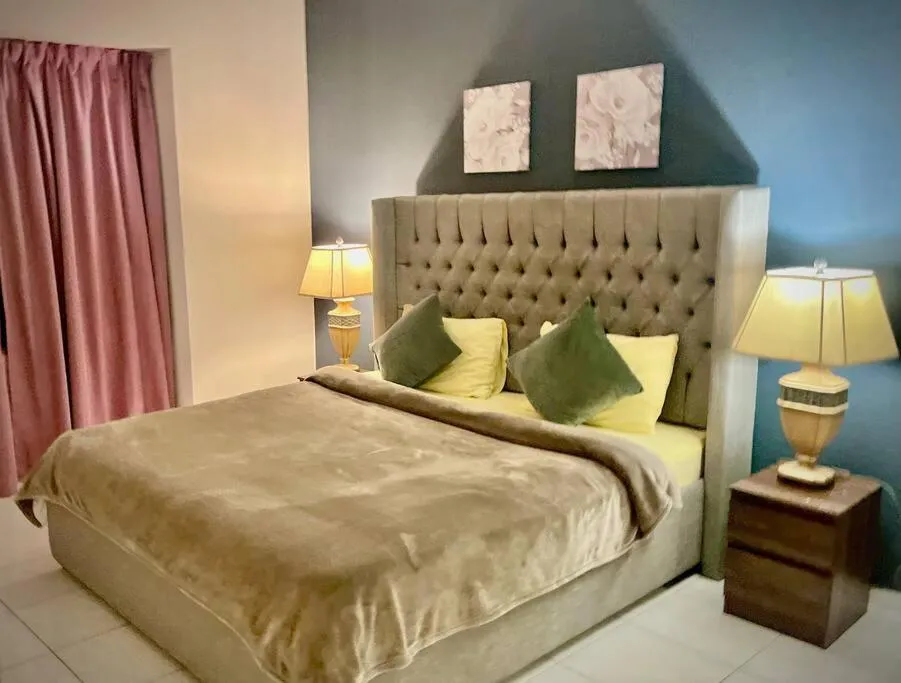 Bed in Chic 3 bedroom apartment