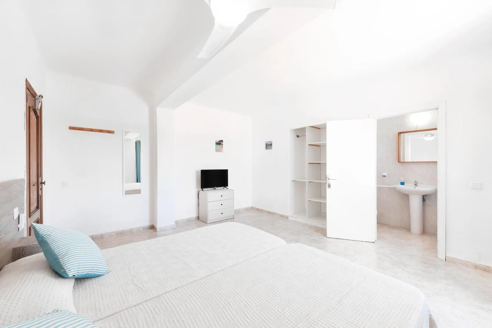 Bed in Hostal Cala Llombards