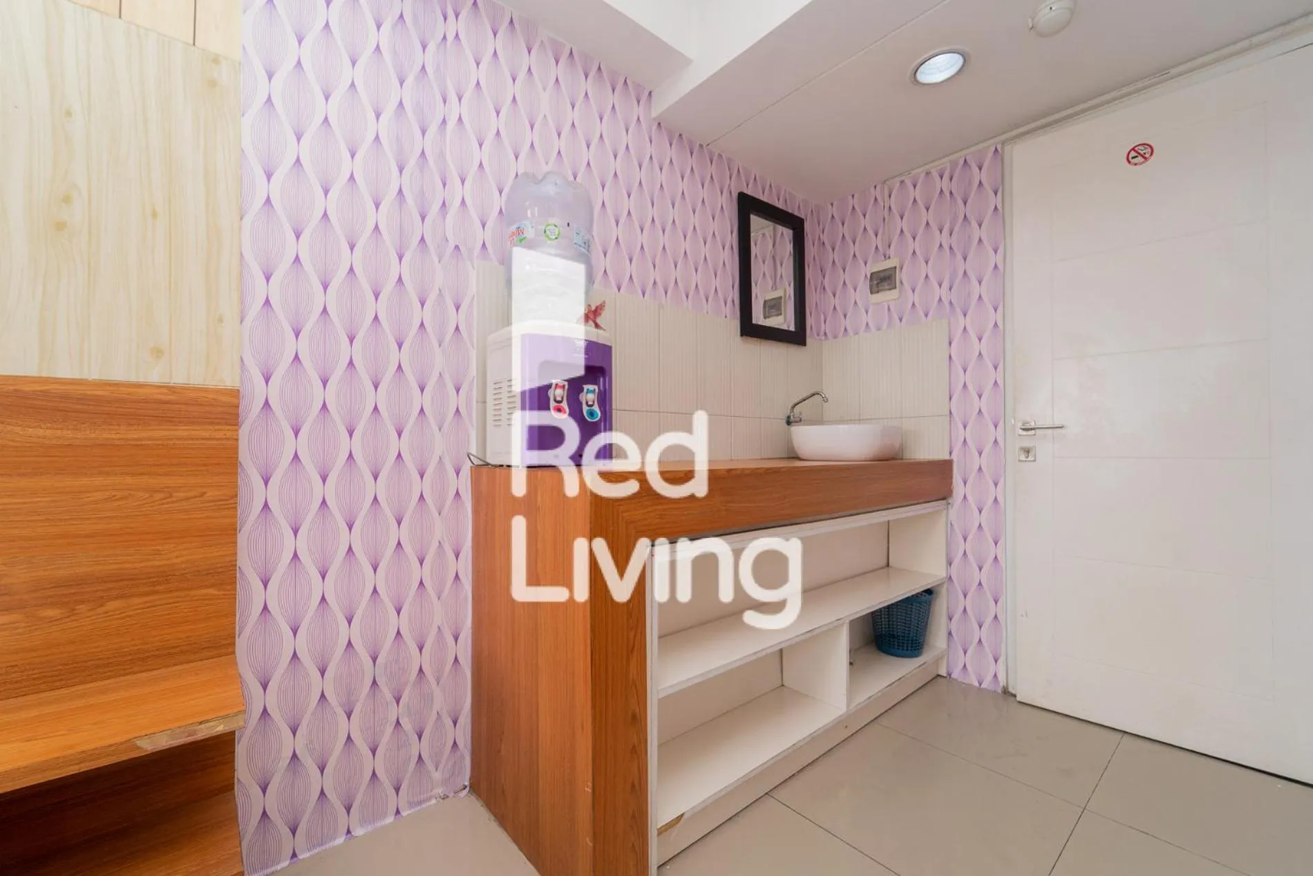 Kitchen or kitchenette, Bed in RedLiving Apartemen Grand Sentraland - Bangde Rooms