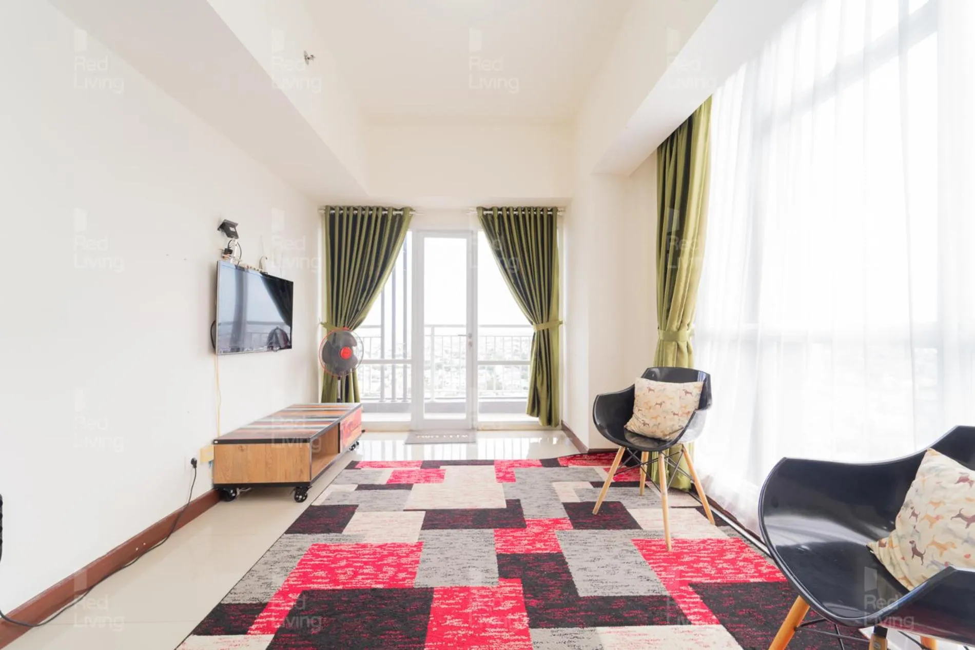 Living room in RedLiving Apartemen Vida View - Vida Connect