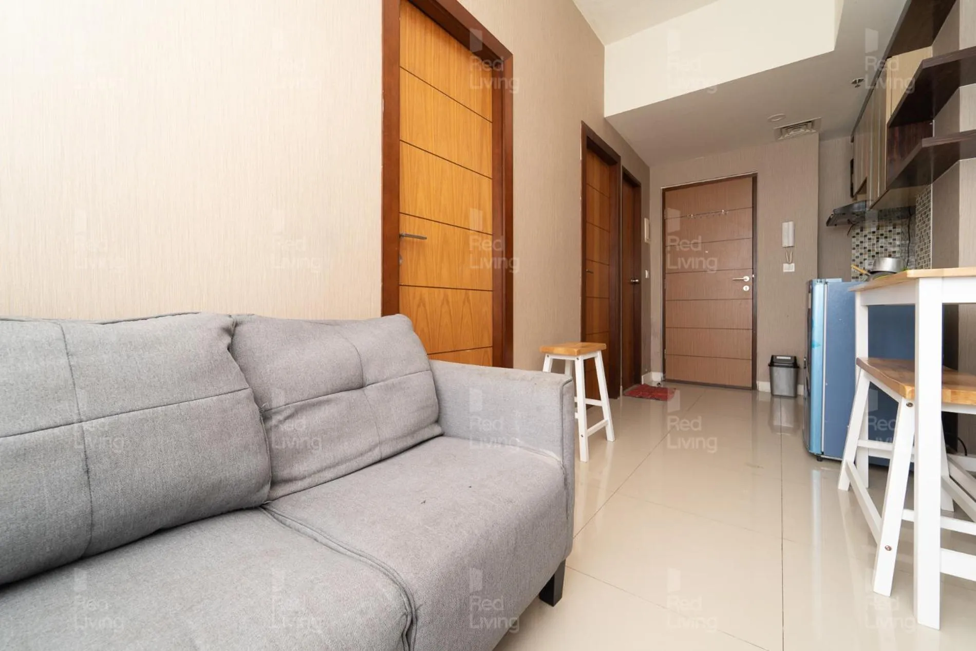 Living room in RedLiving Apartemen Vida View - Vida Connect