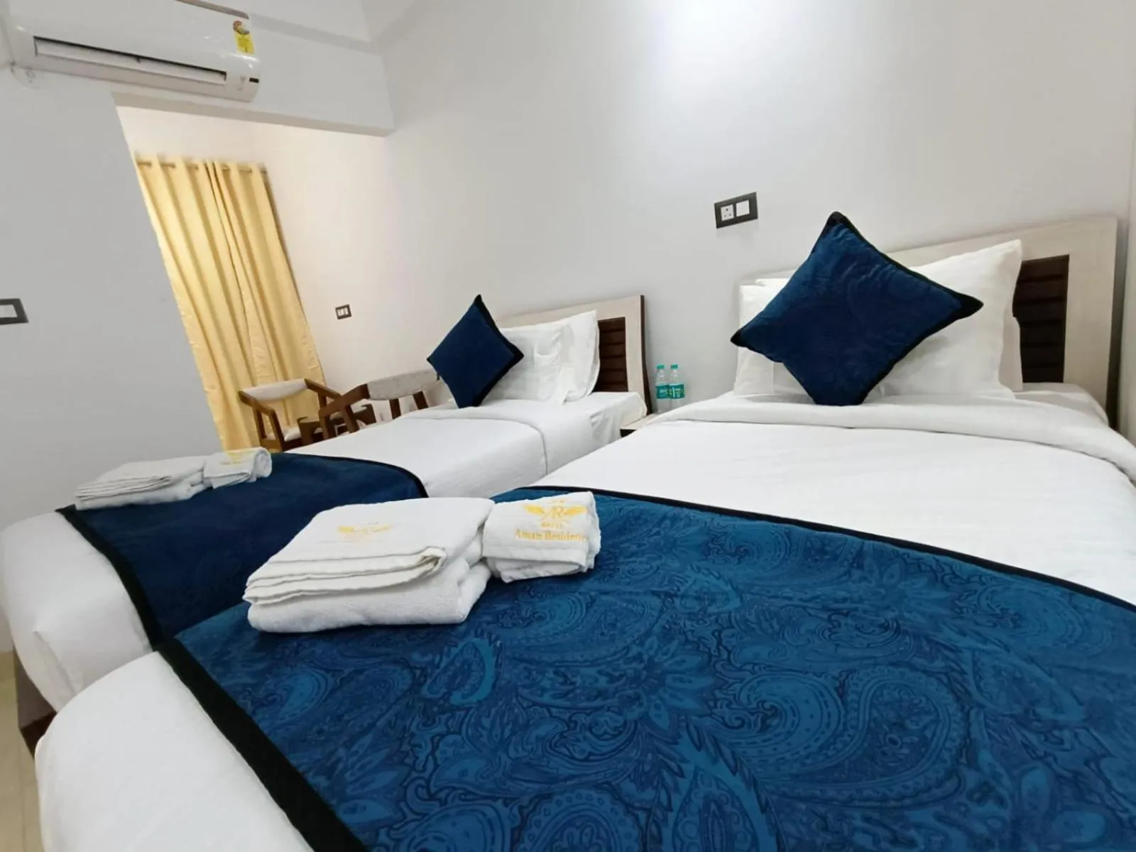 Bed in Hotel Aman Residency