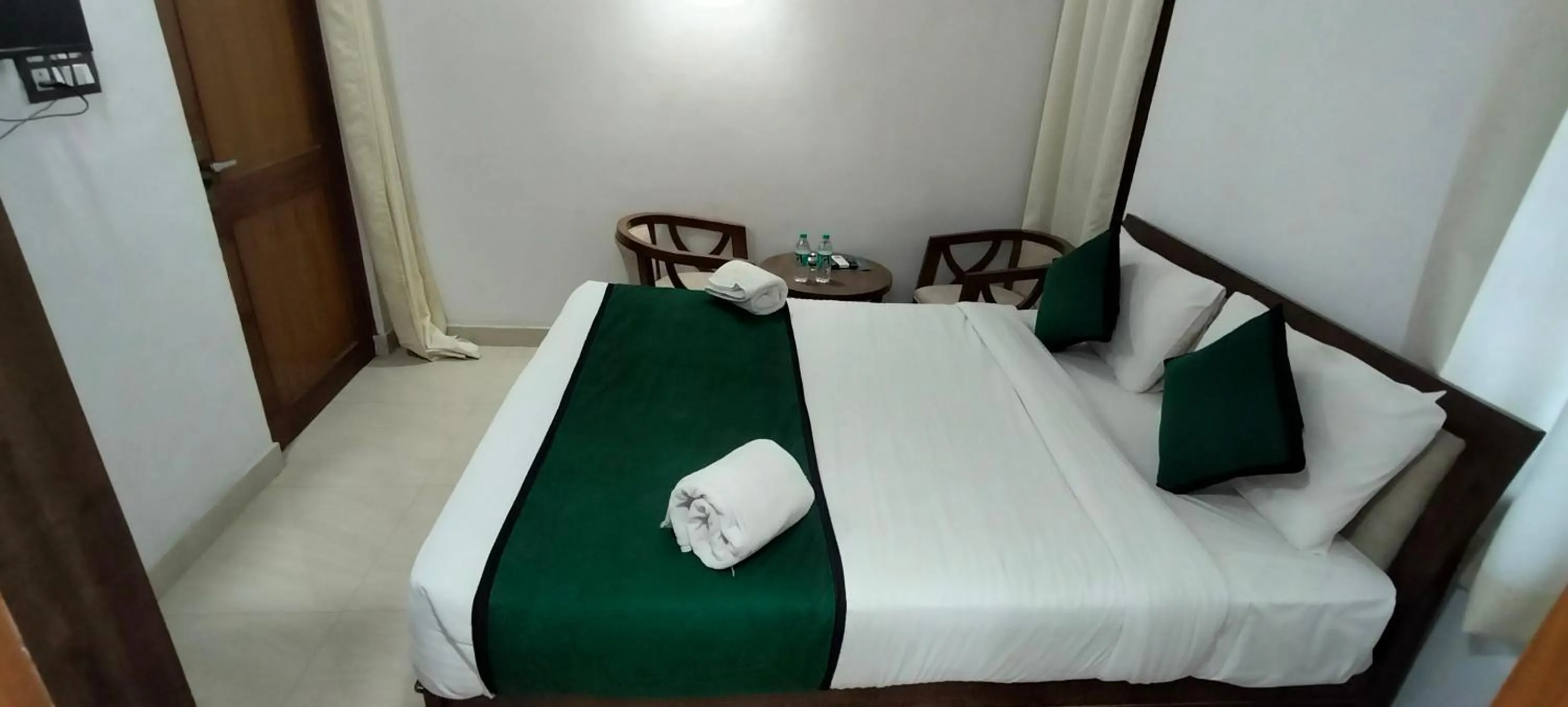 Bed in Hotel Aman Residency