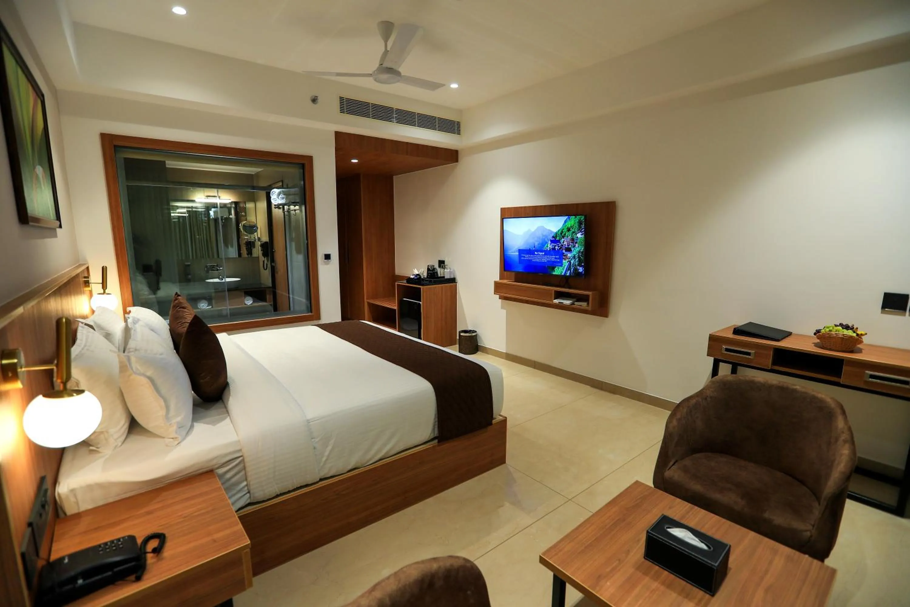 Communal lounge/ TV room, Bed in Hotel Saffron Wayanad