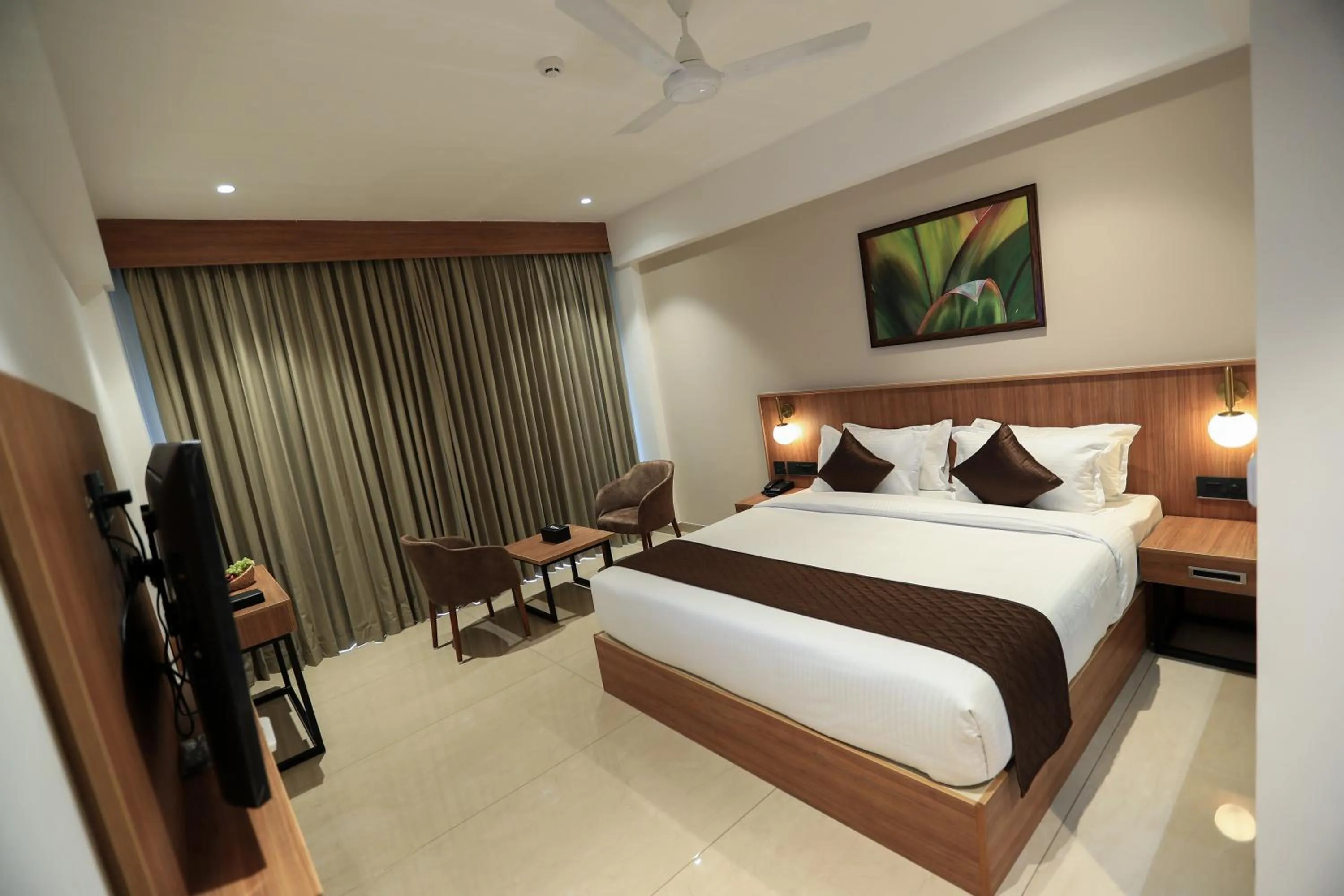 Bed in Hotel Saffron Wayanad